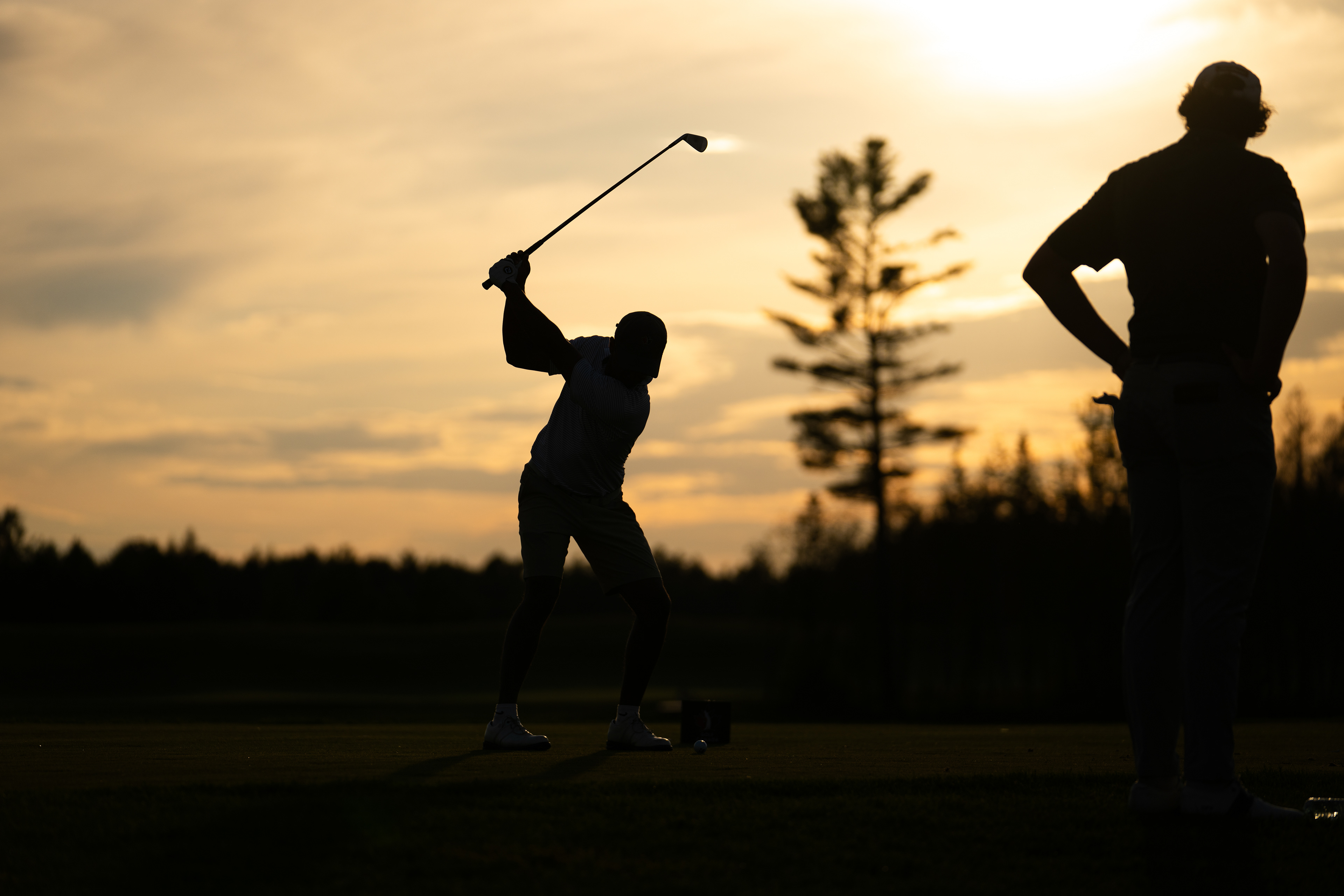 Kavith Ranchagoda tees off on the 12th hole at sunset during the 2026 Canadian University/College Championship at Golf La Tempête on June 17, 2026 in Lévis, Quebec, Canada. (Photo by Jay Barlett)