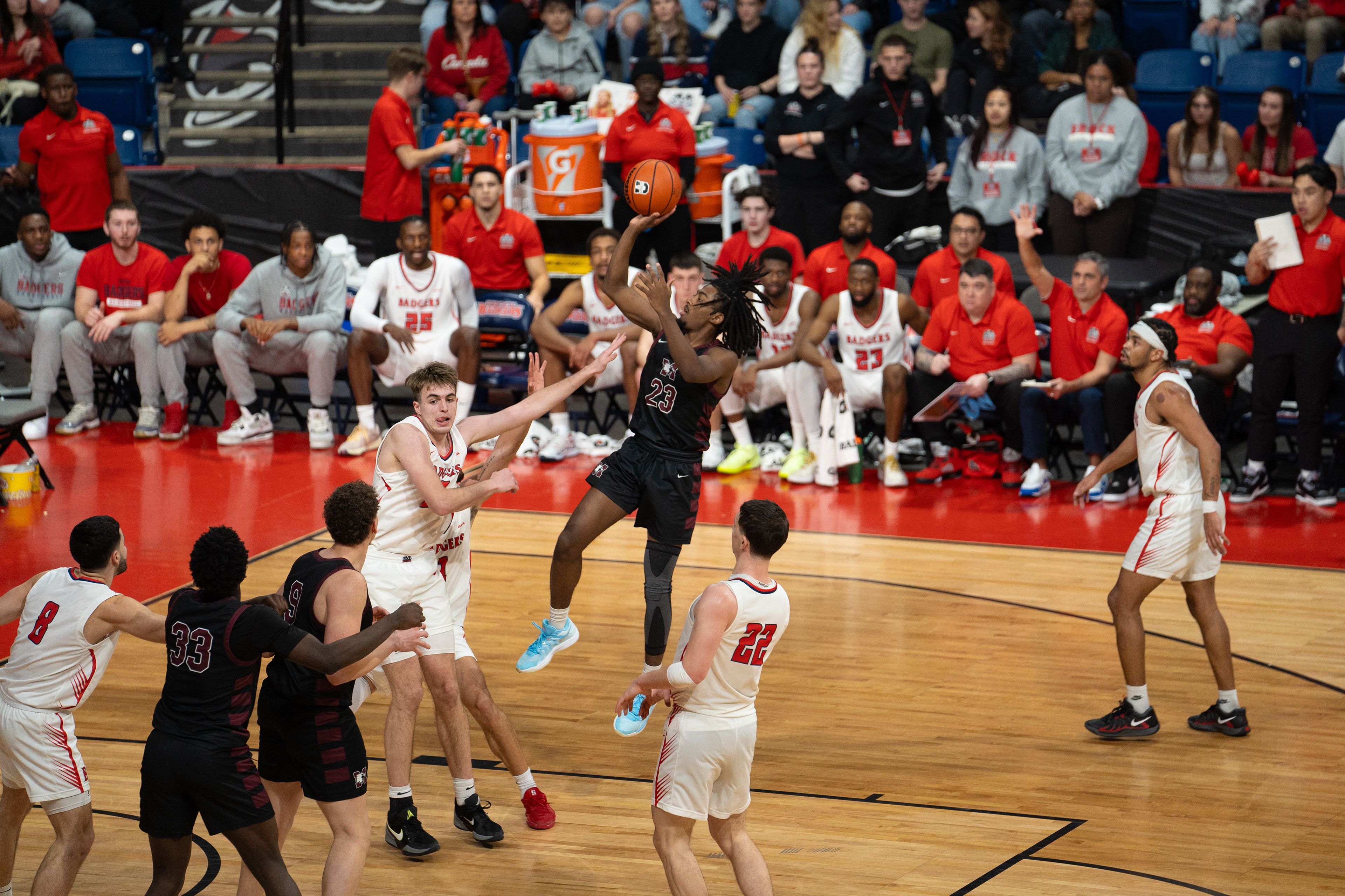 Jeremiah Francis (#23) hits a floater over the Brock Badgers (Photo by Jay Barlett).