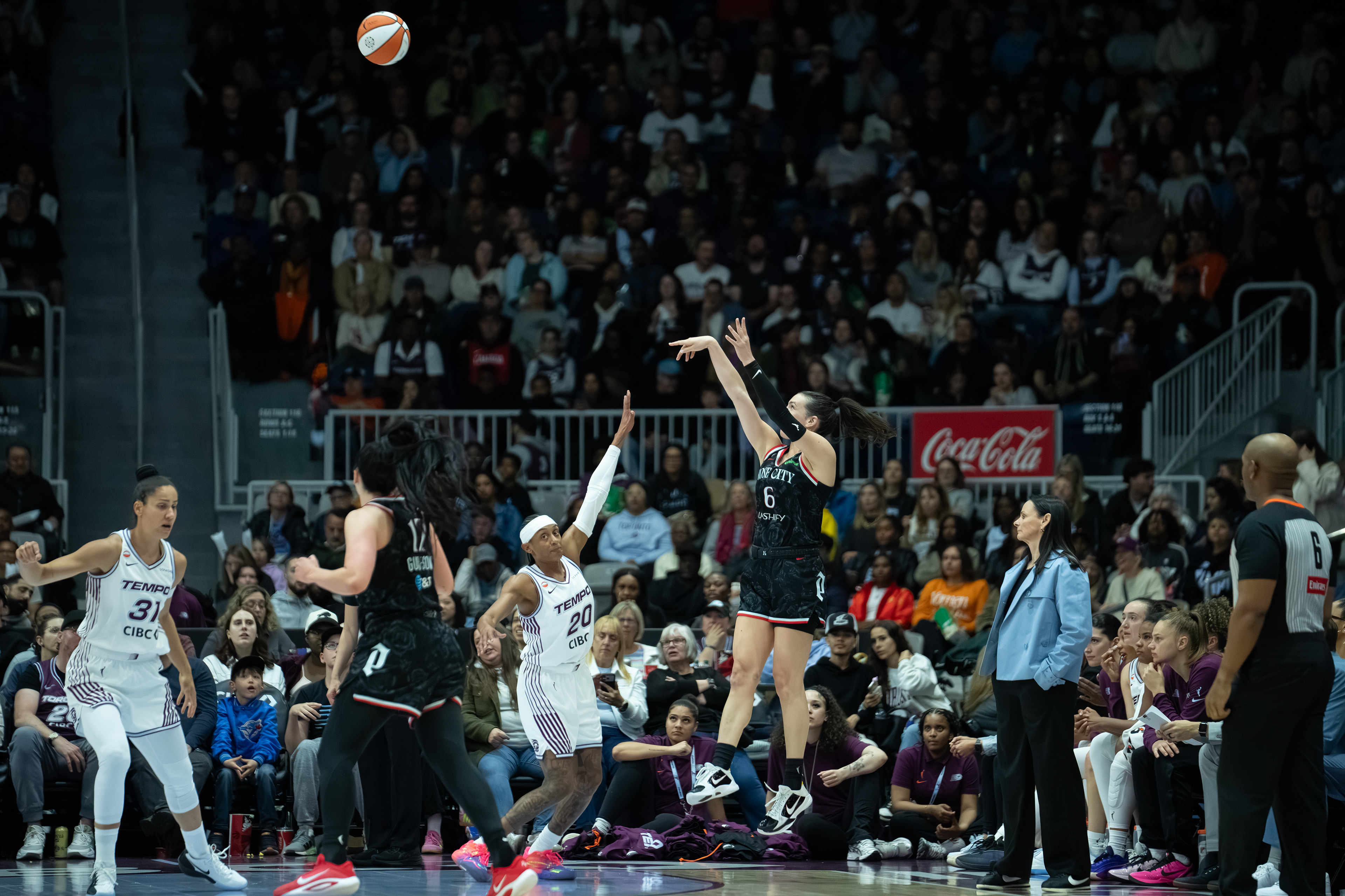 Canadian Bridget Carleton of the Portland Fire attempts a three-point shot over Brittney Sykes of the Toronto Tempo during a WNBA game at Coca-Cola Coliseum on May 23, 2026 in Toronto, Ontario, Canada. (Photo by Jay Barlett)