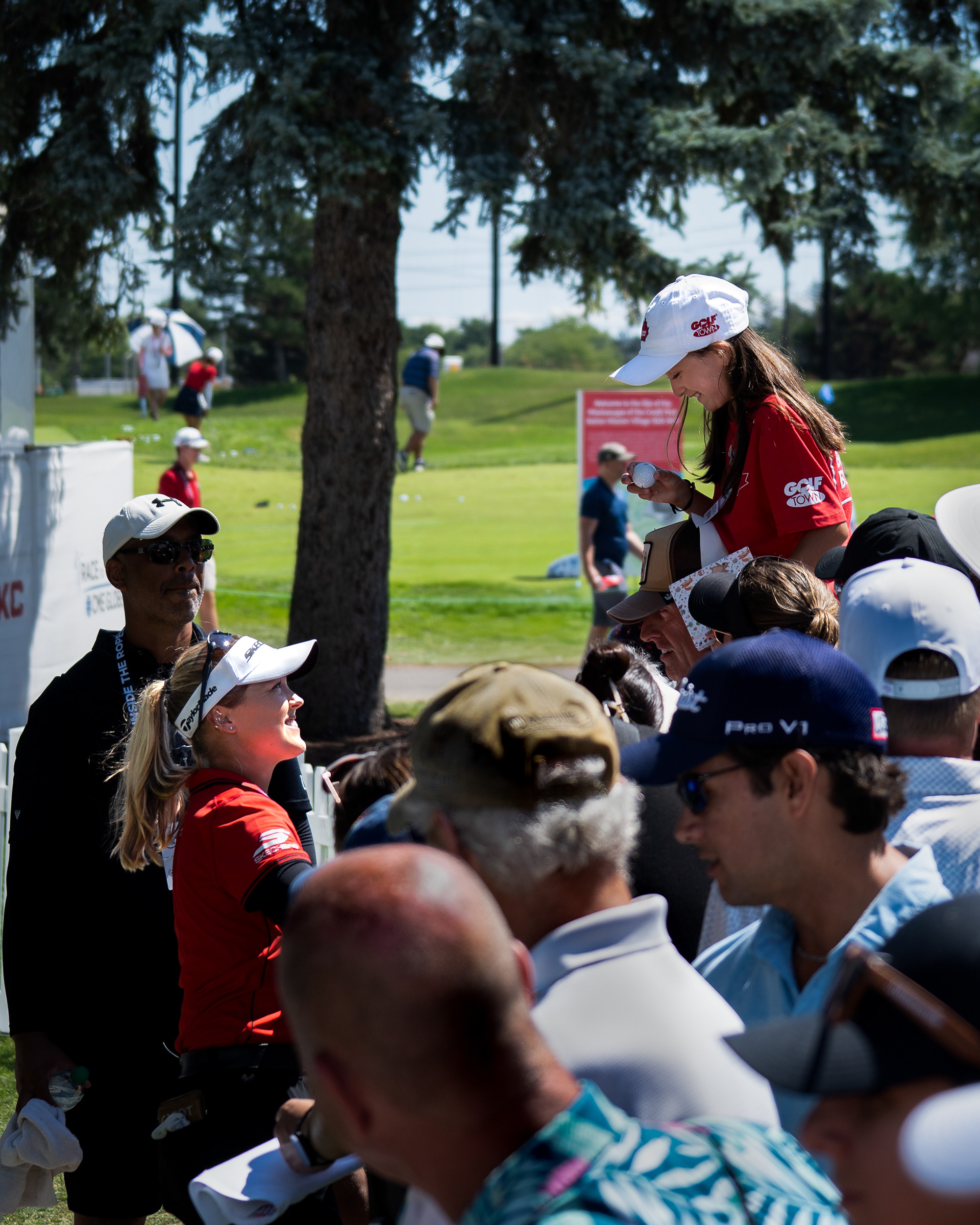 Brooke Henderson of Canada signs an autograph for a young fan following the third round of the CPKC Women’s Open at Mississaugua Golf and Country Club on August 23, 2025 in Mississauga, Ontario, Canada. (Photo by Jay Barlett)