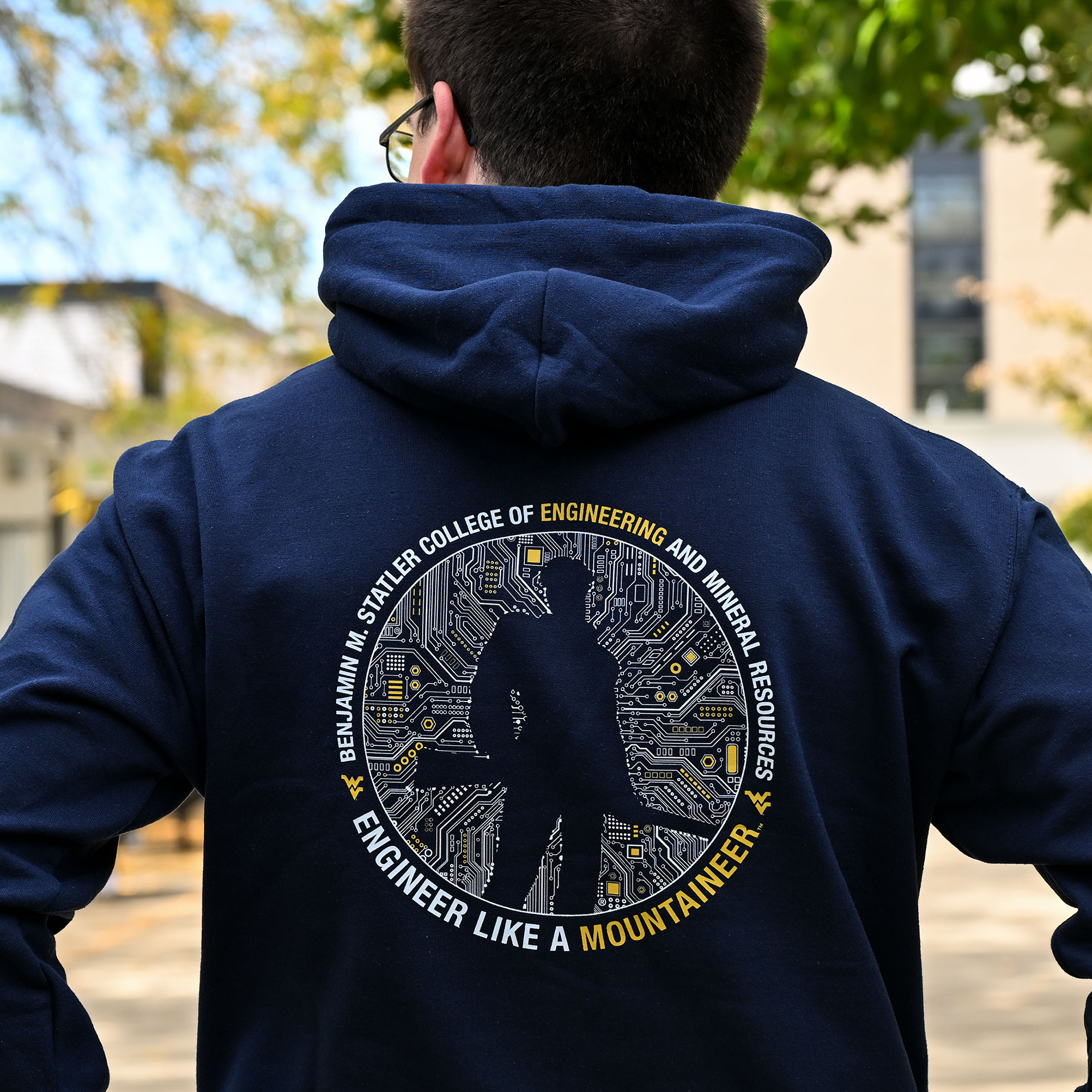 2025 Fall Flash sale apparel graphics; the silhouette of the Mountaineer mascot framed by circuits. Around the graphic: "Benjamin M. Statler College of Engineering and Mineral Resources: Engineer Like a Mountaineer".