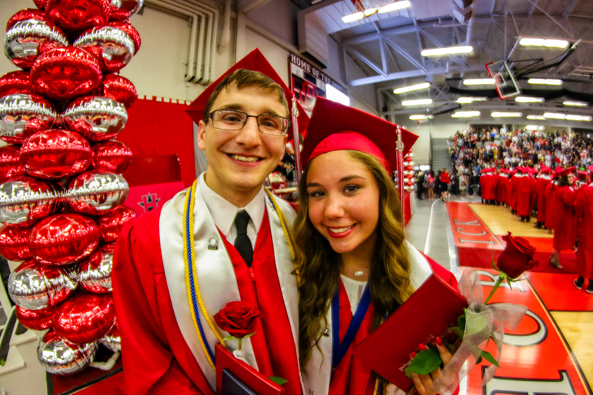 Salutatorian Ethan Gegare (left) and Valedictorian Marlee Reischl (right) pose for a photo after Horlick High School's Commencement Ceremony, June 9, 2019.