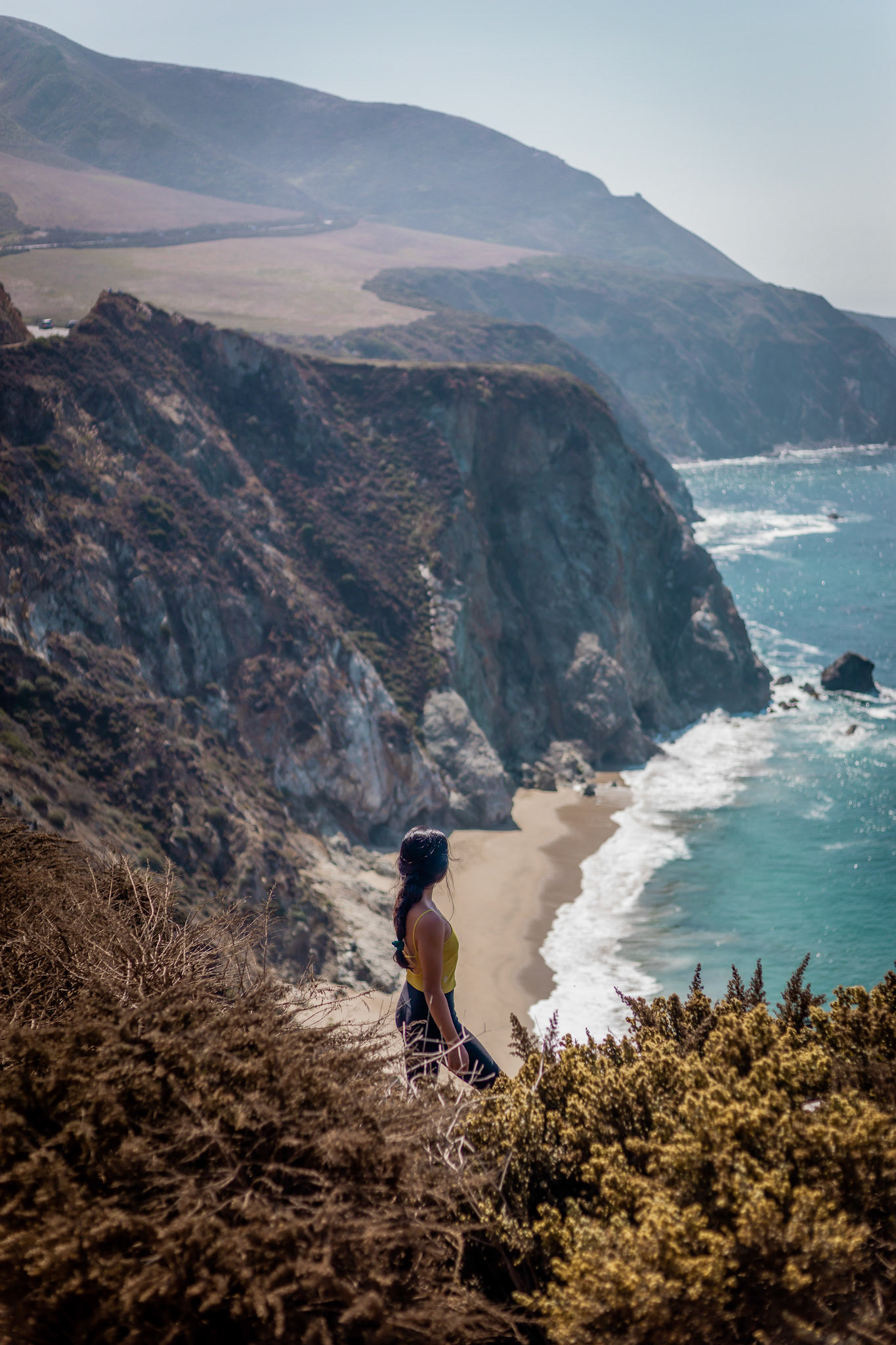 WomanOverlooking Ocean &amp; Cliffs