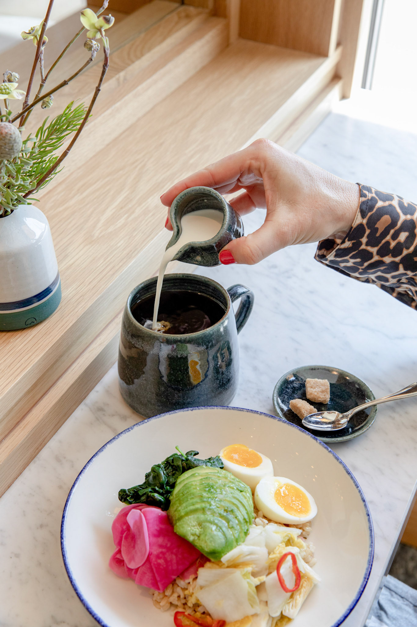 Pouring Milk Into Coffee