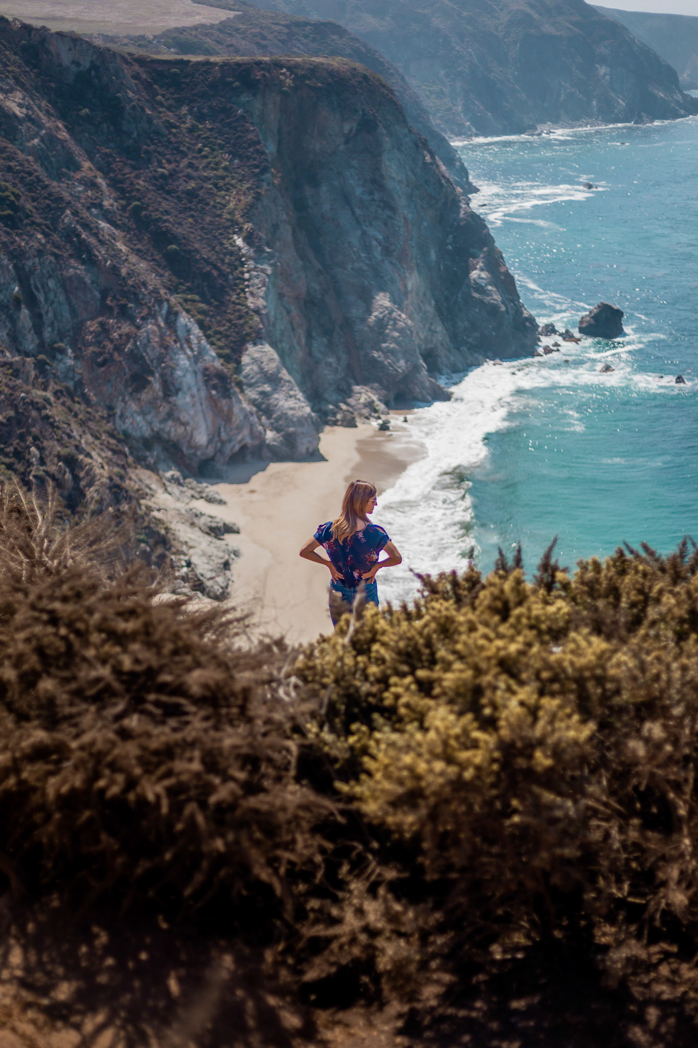 WomanOverlooking Beach &amp; Cliffs 1