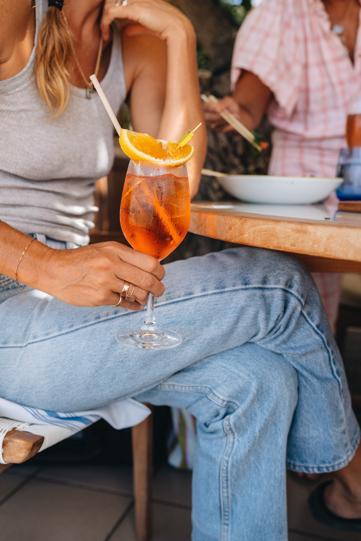 Woman Holding orange Cocktail