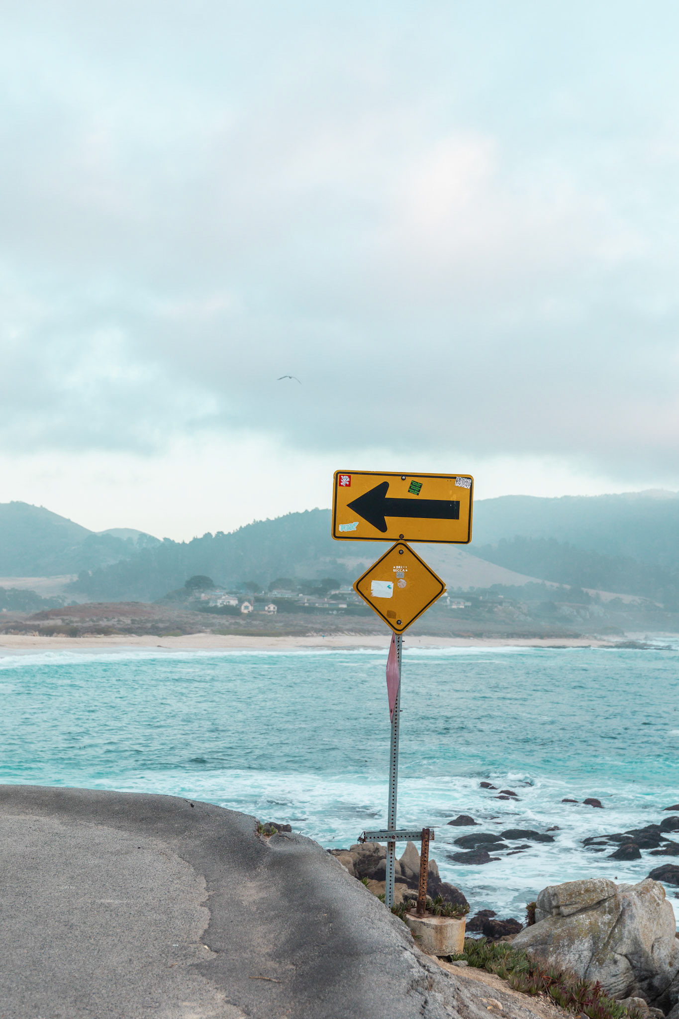 CoastalRoad Sign with Mountains