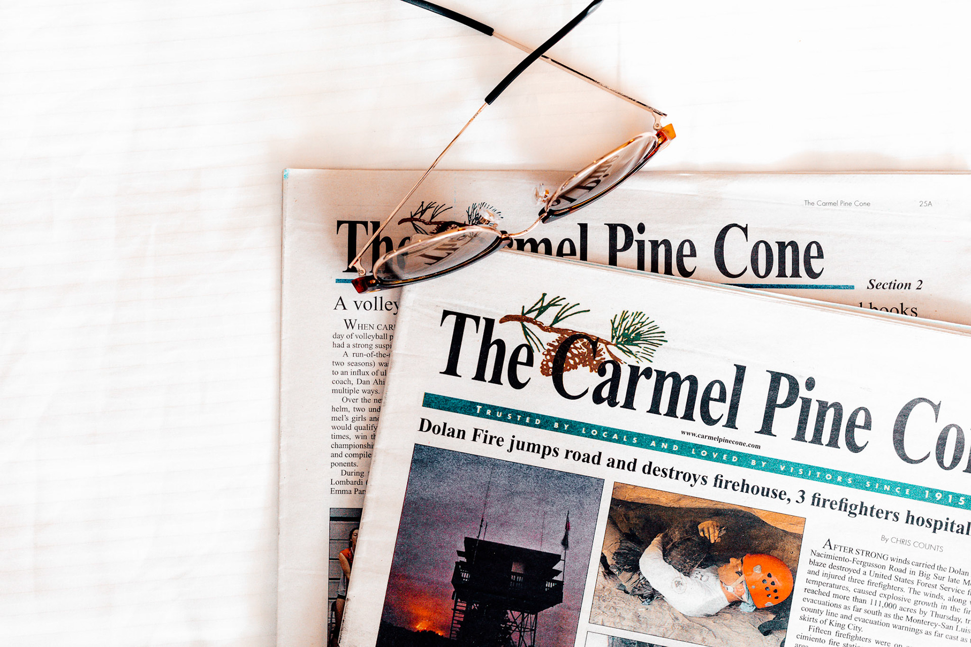 Carmel Pinecone Sunglasses on Newspapers 1