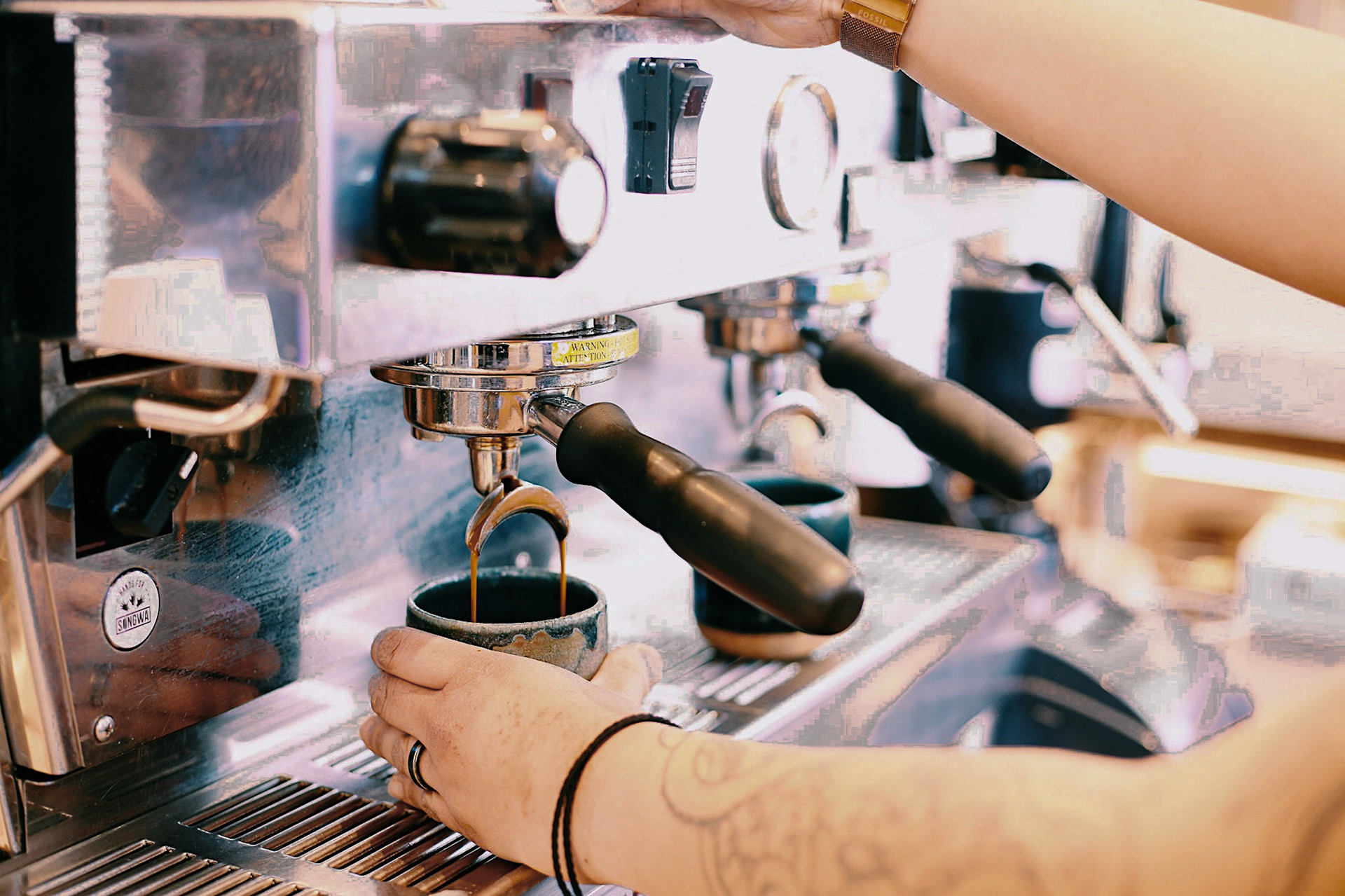Pouring Espresso Into Cups