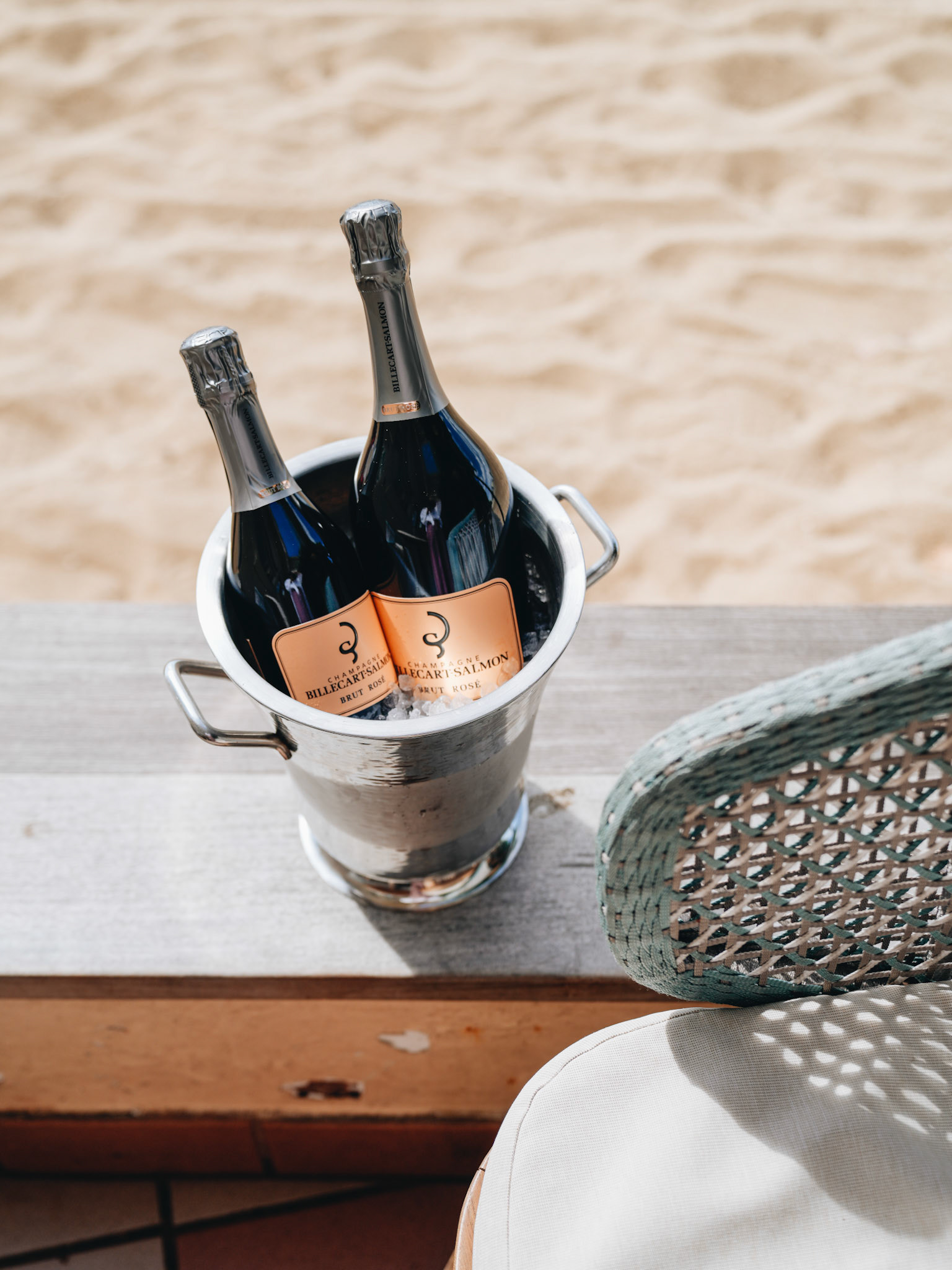 Chilled Champagne Bottles on Beach