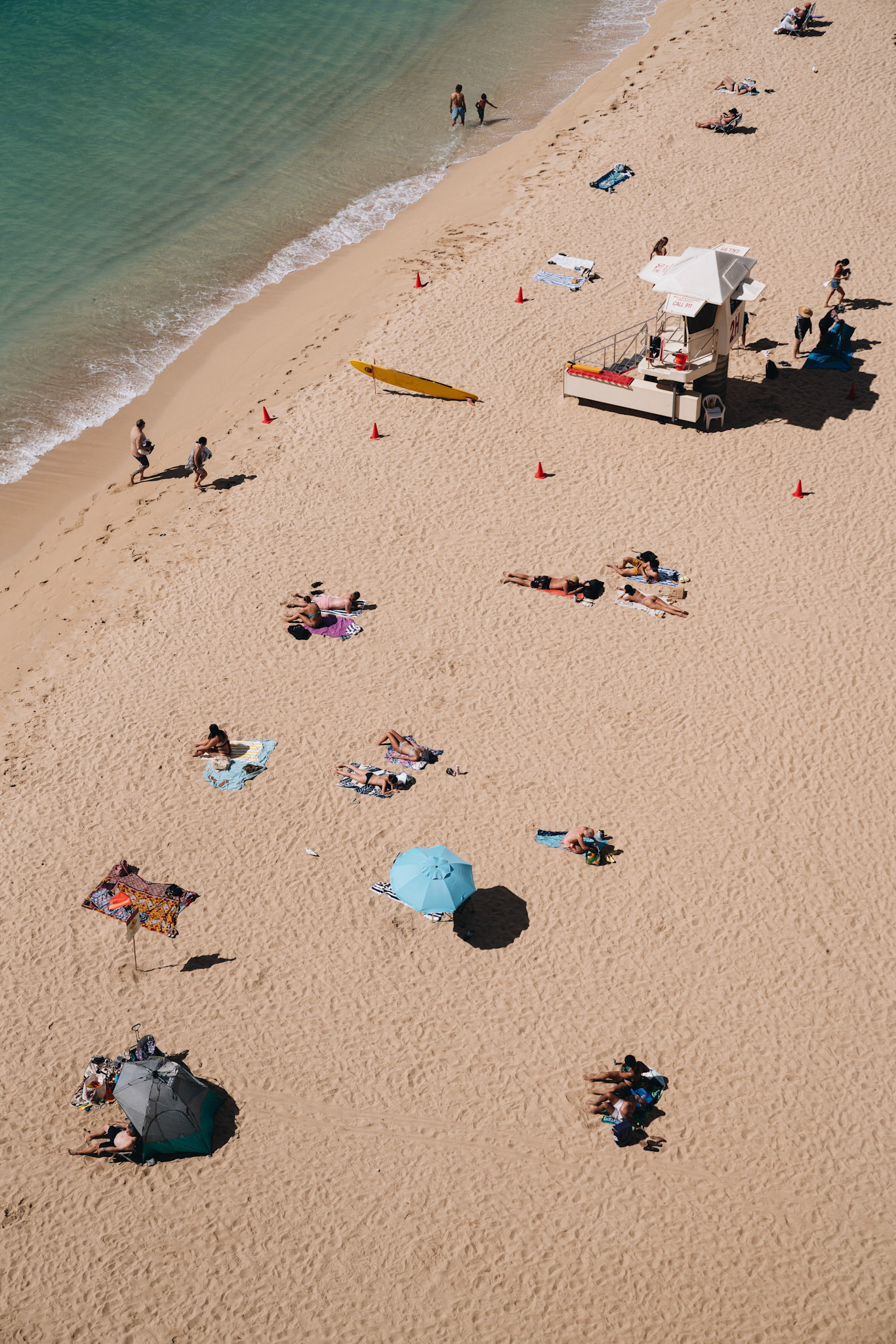 People Sunbathing &amp; Relaxing on Beach