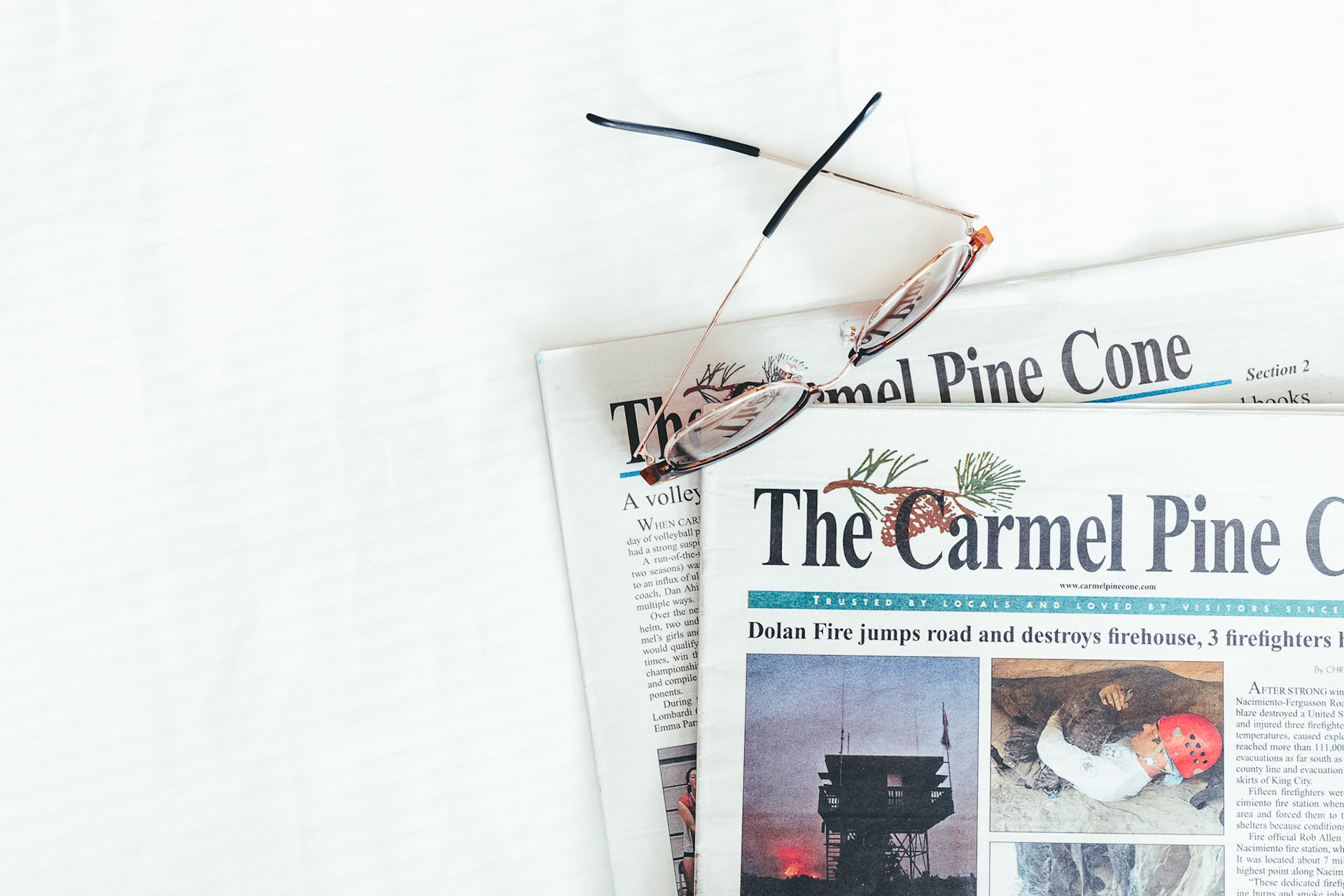 Carmel Pinecone Glasses on Newspapers