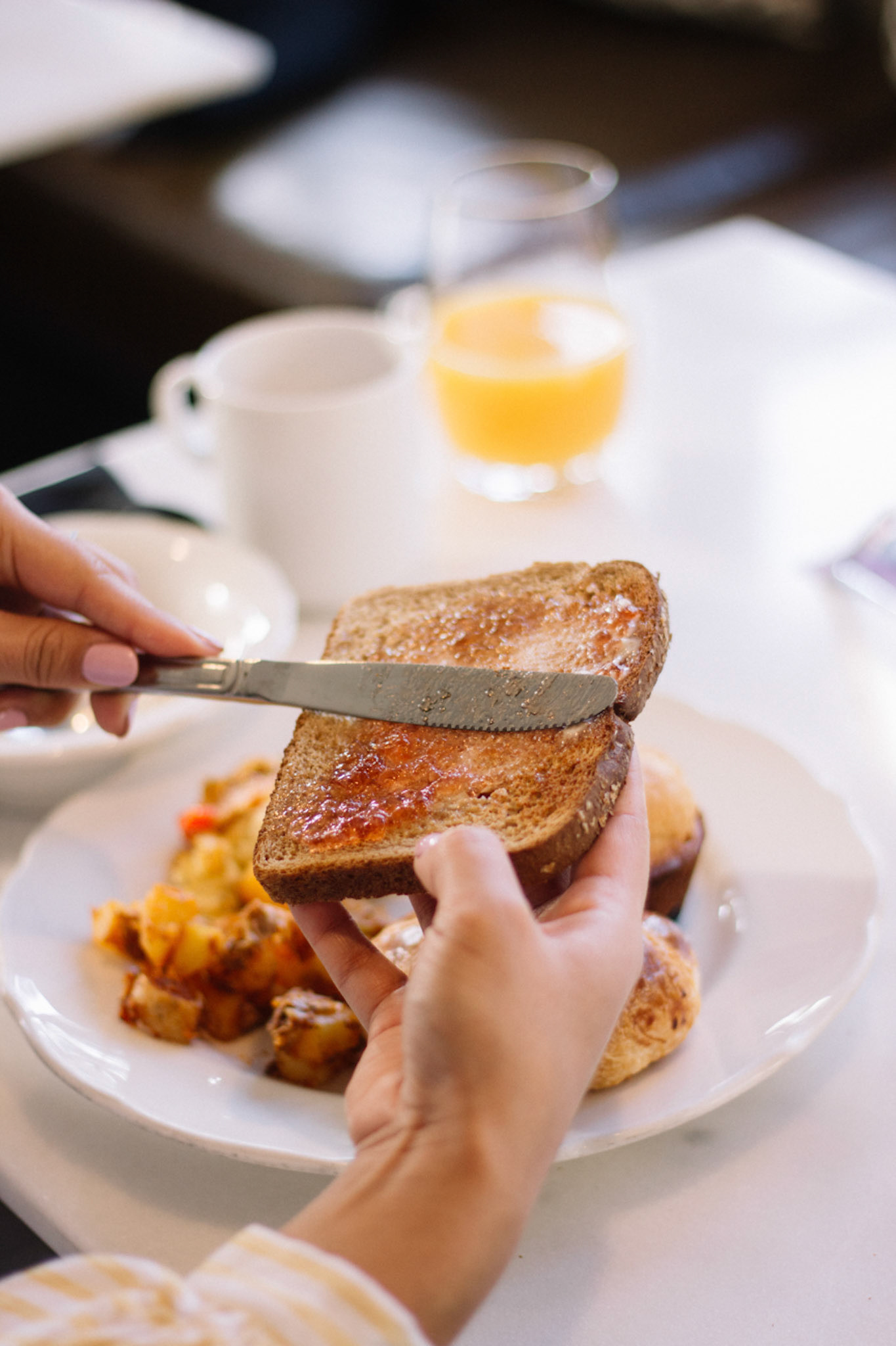 Person Spreading Jam on toast
