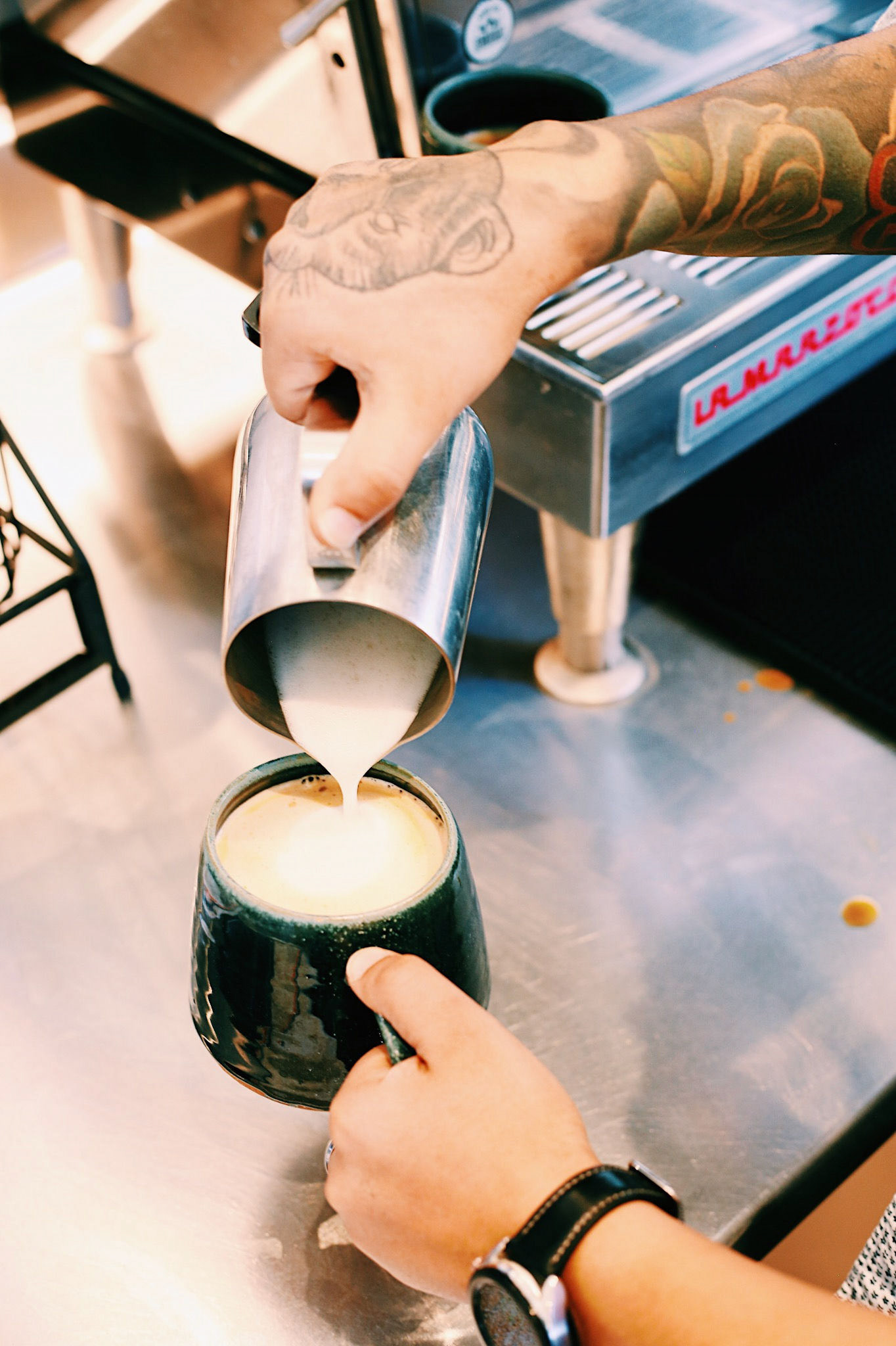 Pouring Milk Into Coffee