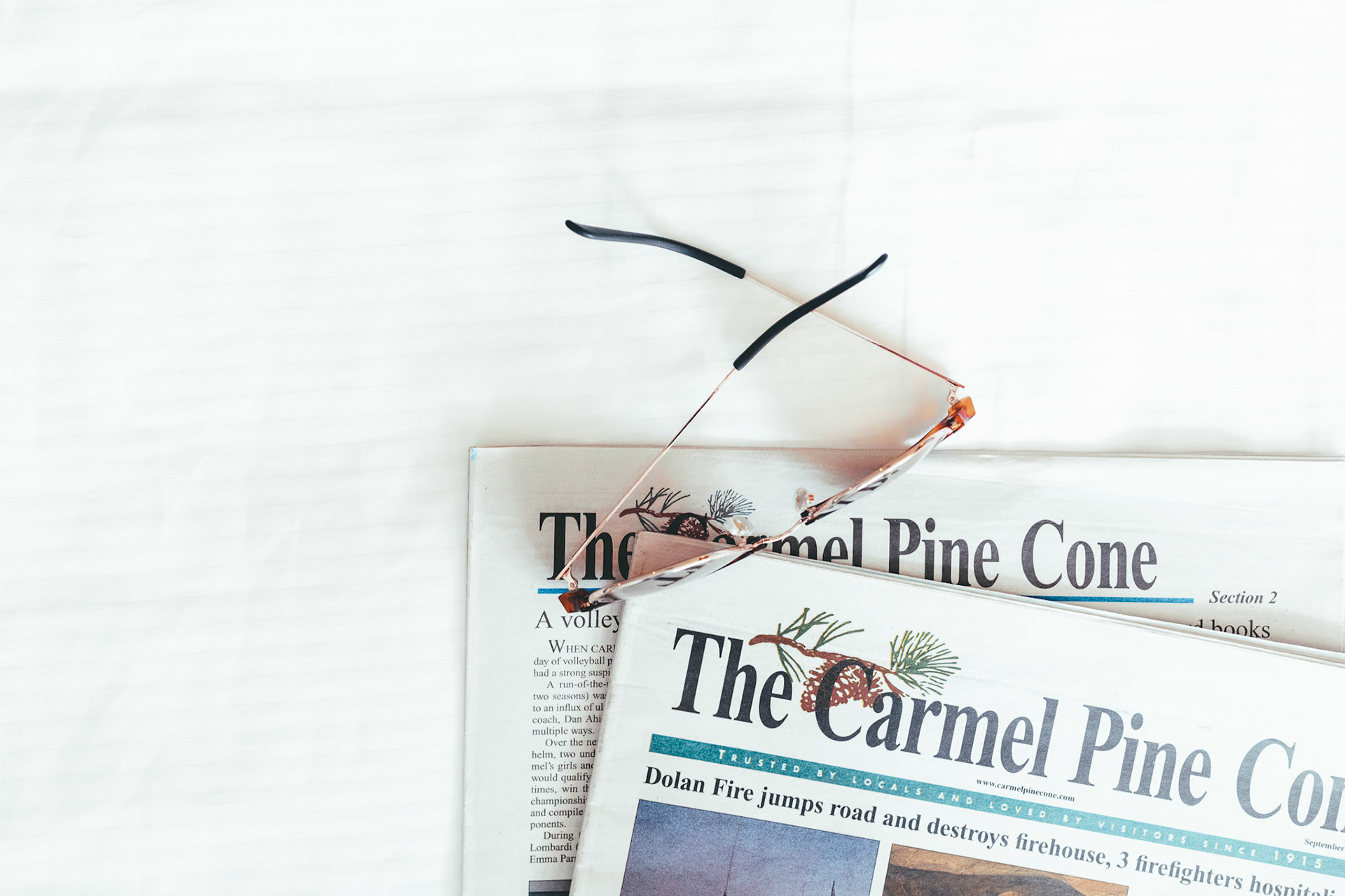 Carmel Pinecone Eyeglasses on Newspapers