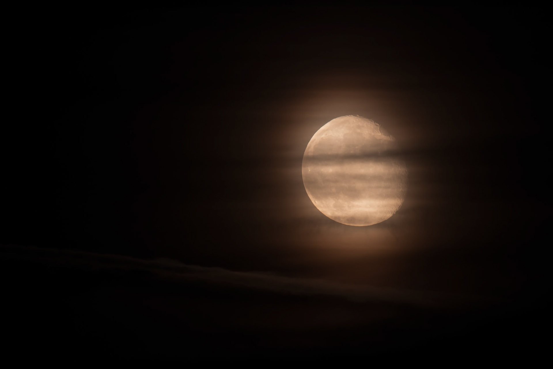 Not quite full moon, after rising way above the cement factory.
