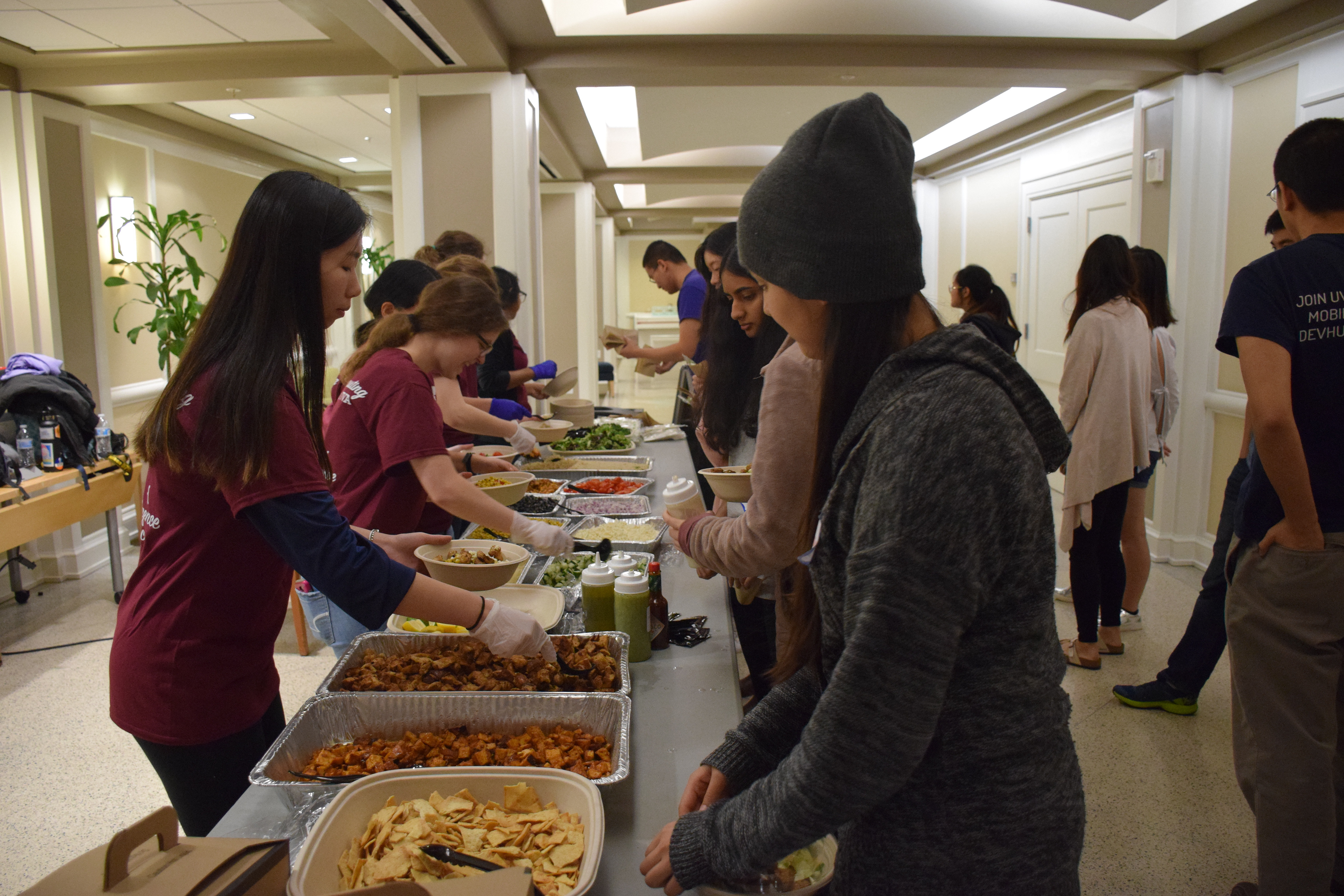 WiCS volunteers serving Roots bowls