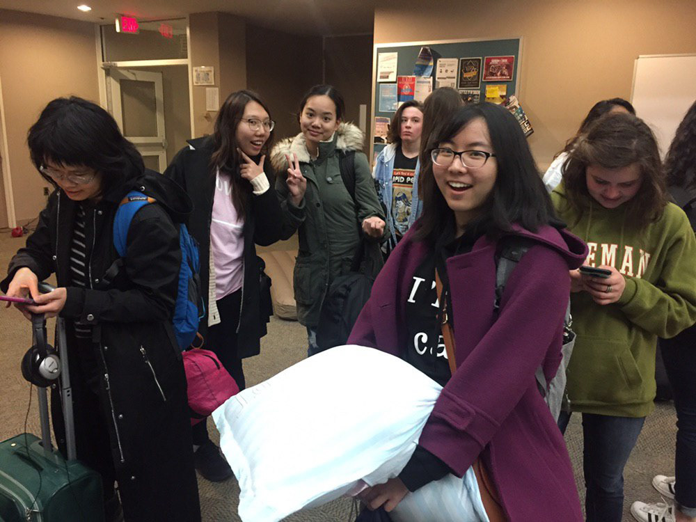 Girls waiting in line to get an air mattress