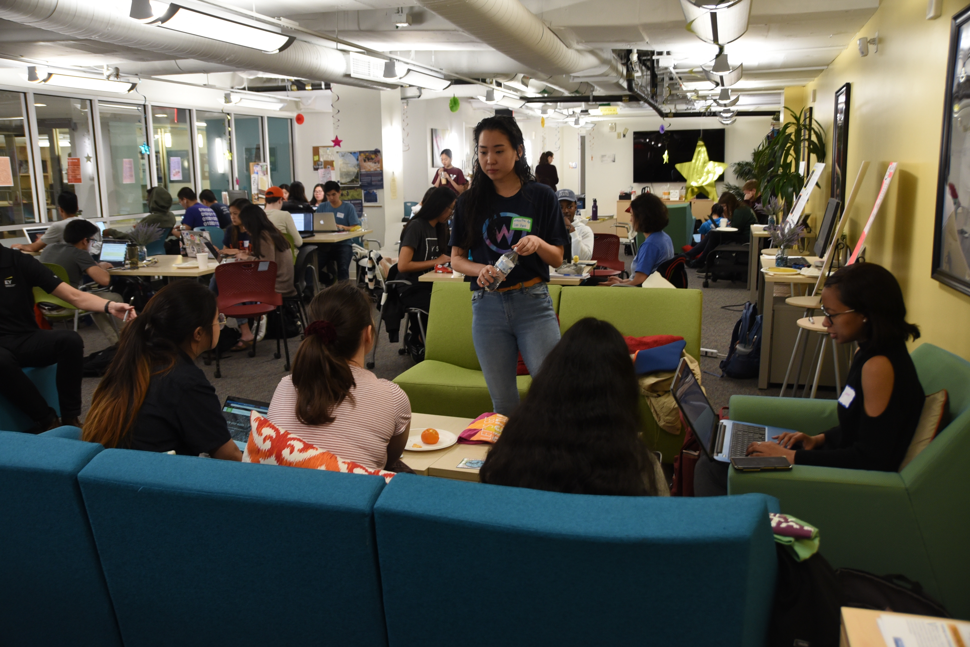Mentor from WillowTree helping students with code