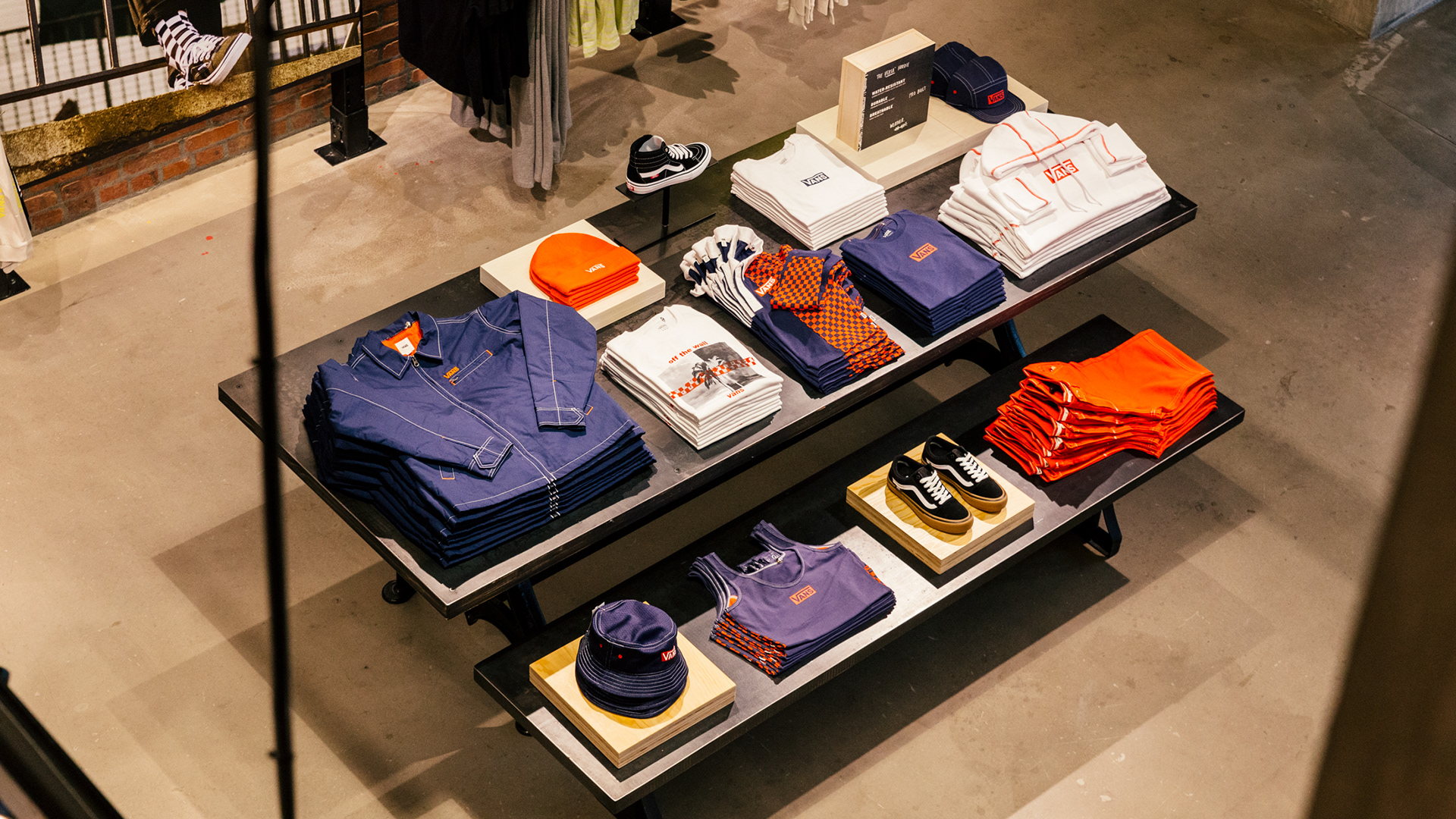 Merchandised apparel and footwear table in DTLA brand showcase