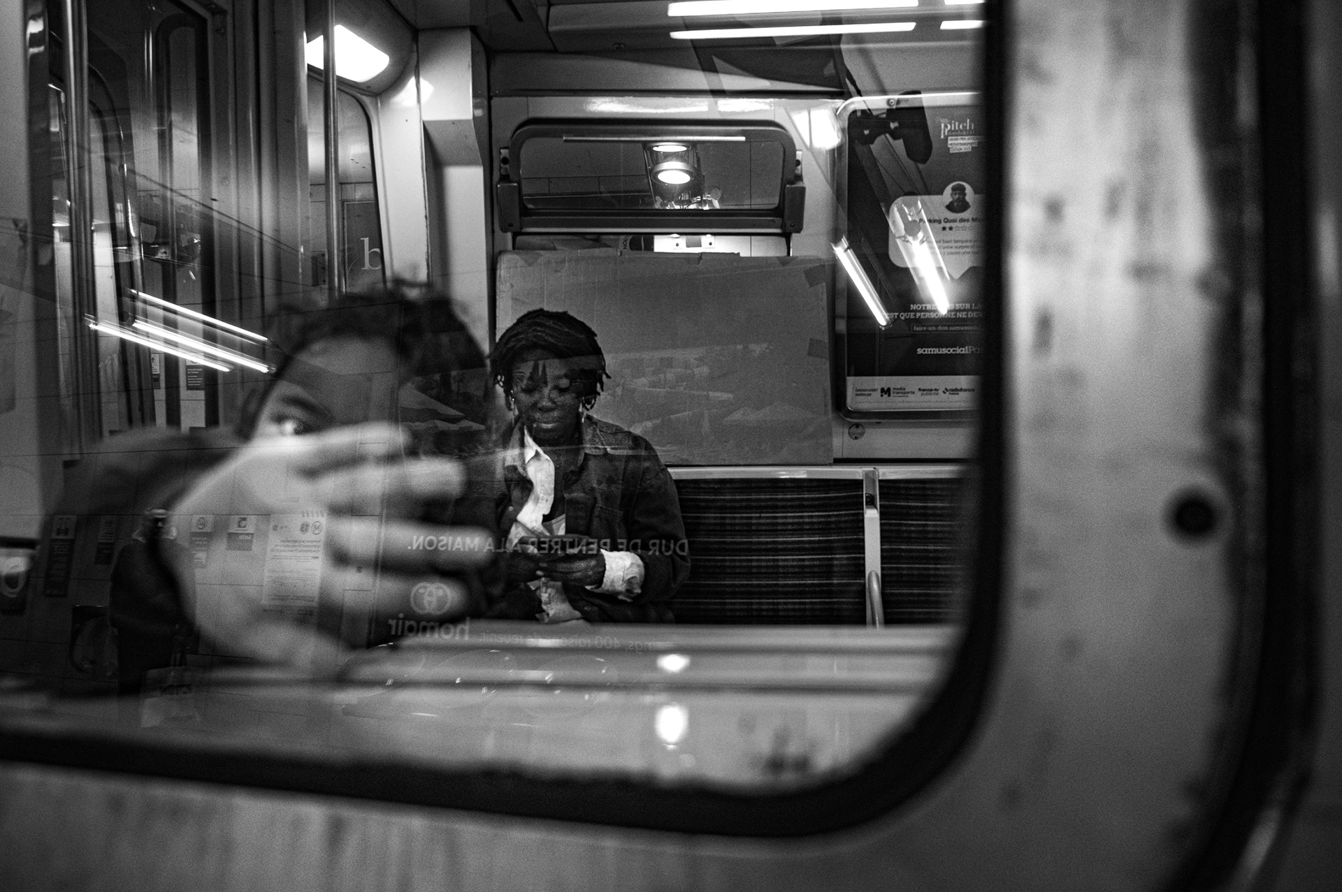 Paris Metro, March 12, 2026. Krissima’s son places his hand on the metro window as he accompanies her to the place where she's preparing the opening of her new exhibition “Mom Latte”, a satirical  and scientifically informative installation on breastfeeding. 