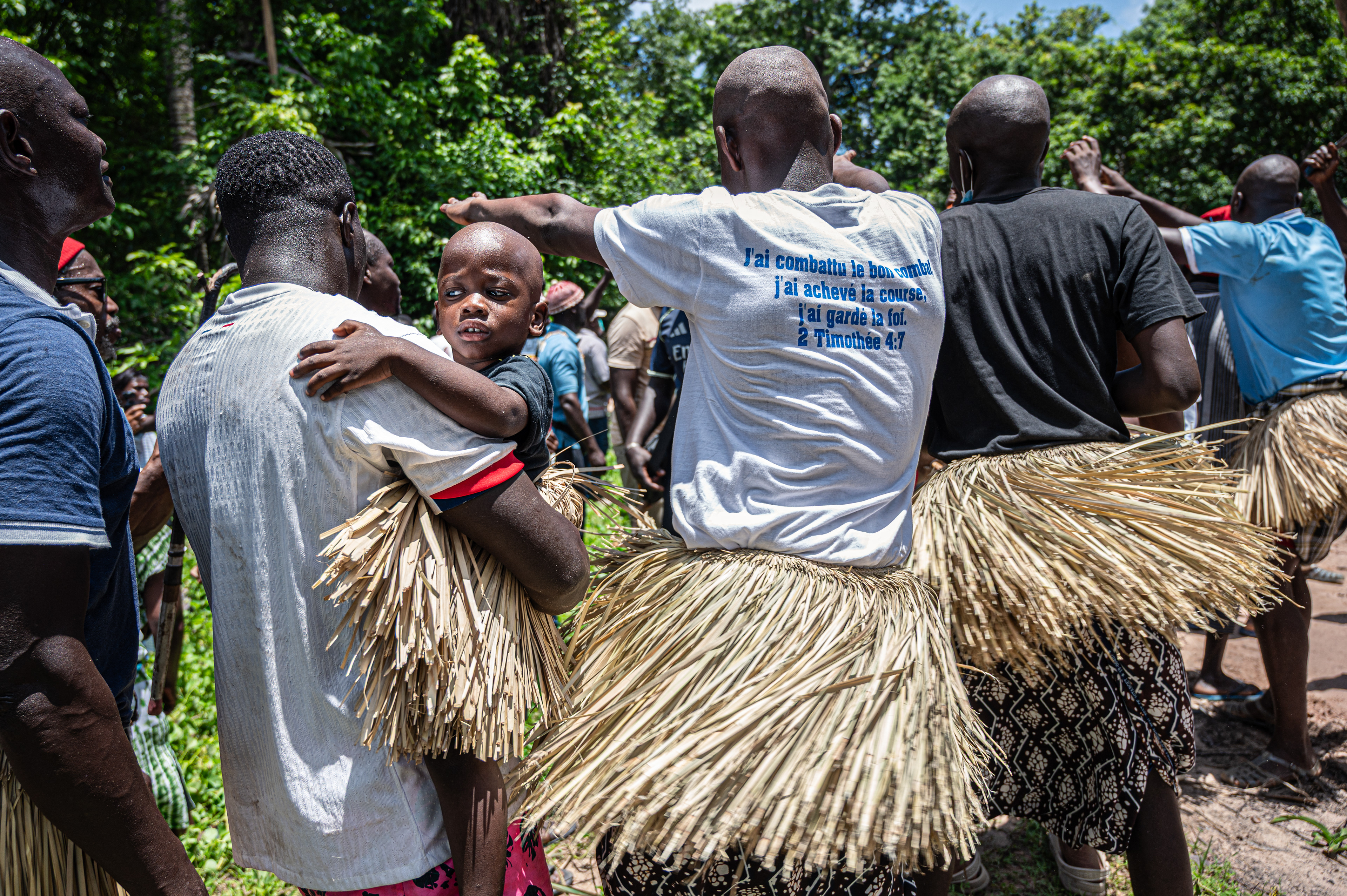 Novices with shaved heads making their way towards the sacred forest during the Boukout ceremony in Sengalene village, Casamance region, Senegal. August 22, 2026.