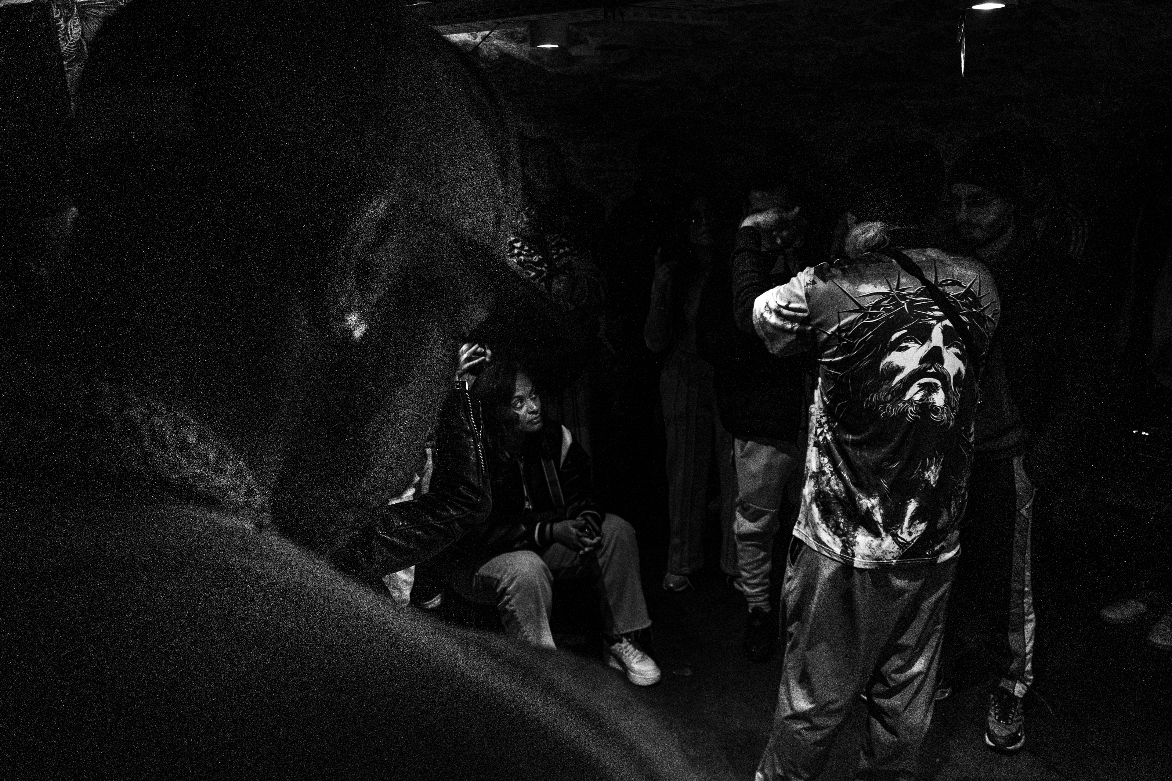 "Le Fokus" bar, 18th arrondissement, Paris. October 24th,  2025. During an open mic, Captn'Kurt who's rapper and producer of the collective, assists the performance of the cuban MC named Narra.