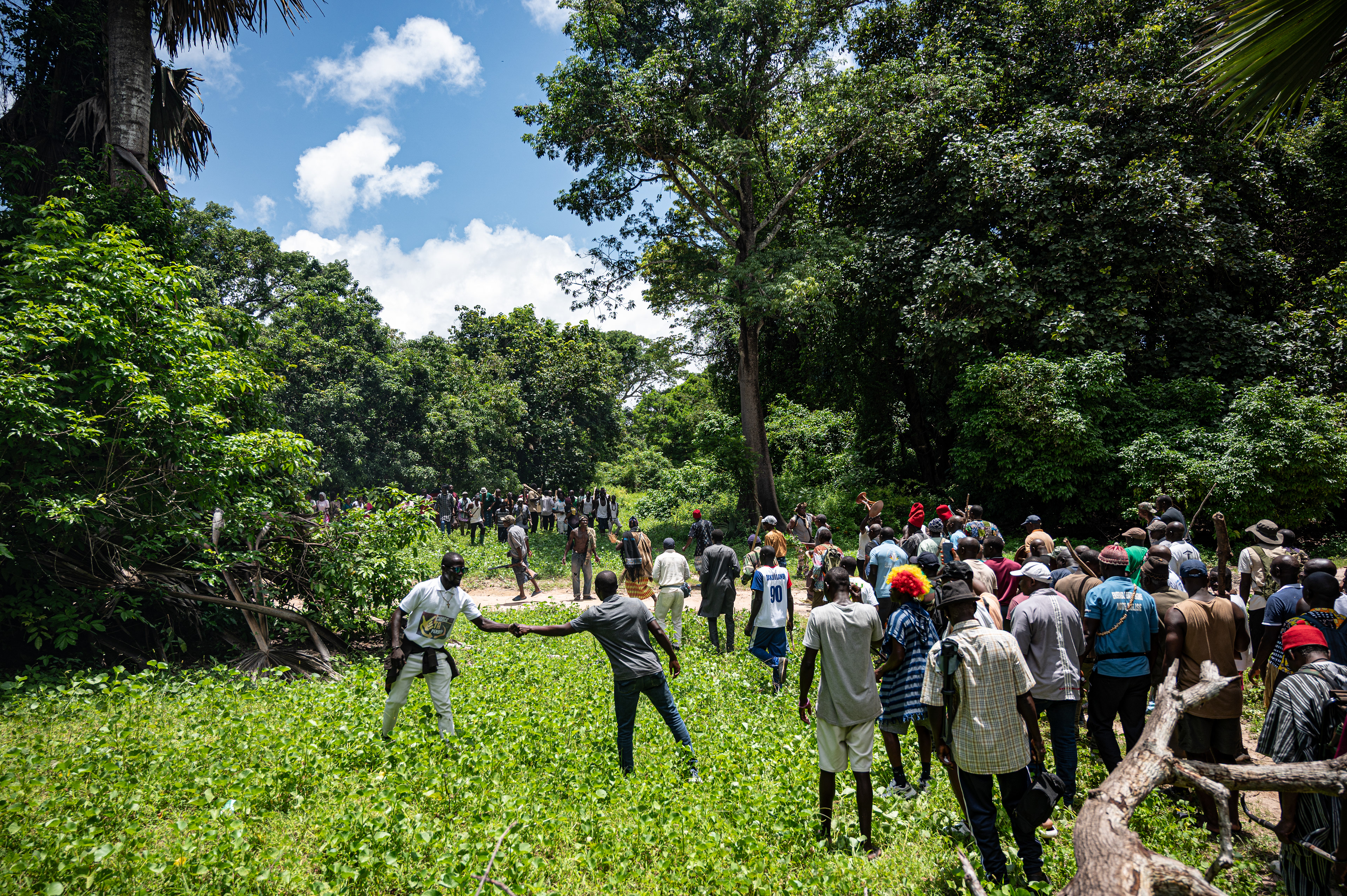 The villagers accompany the novices towards the sacred forest during the Boukout ceremony in Sengalene village, Casamance region, Senegal. August 22, 2026.