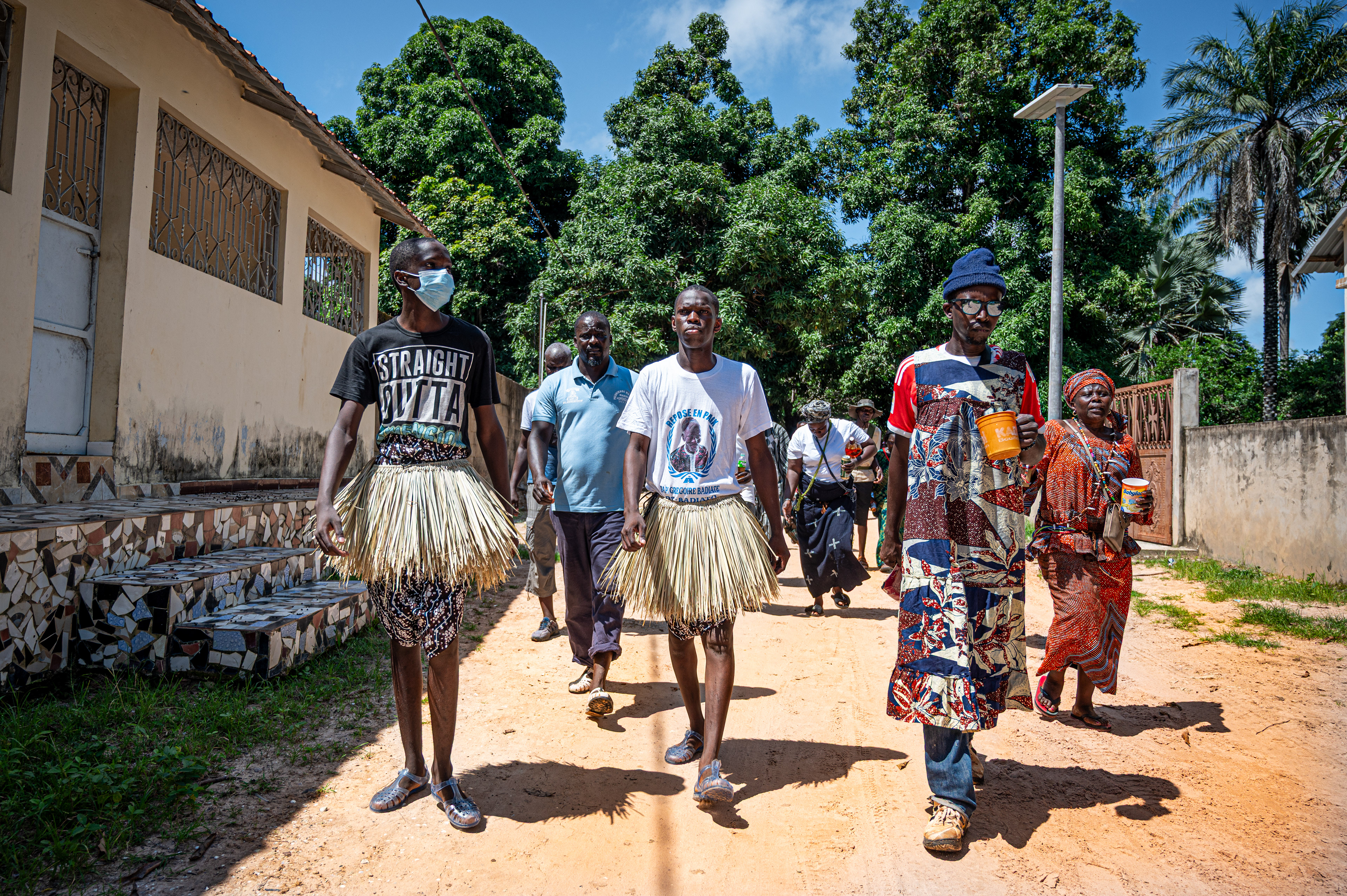 Stefano (left) and Guido (right), two Diola brothers, are on their way to their Boukout ceremonies in Sengalene village, Casamance region, Senegal. August 22, 2026.