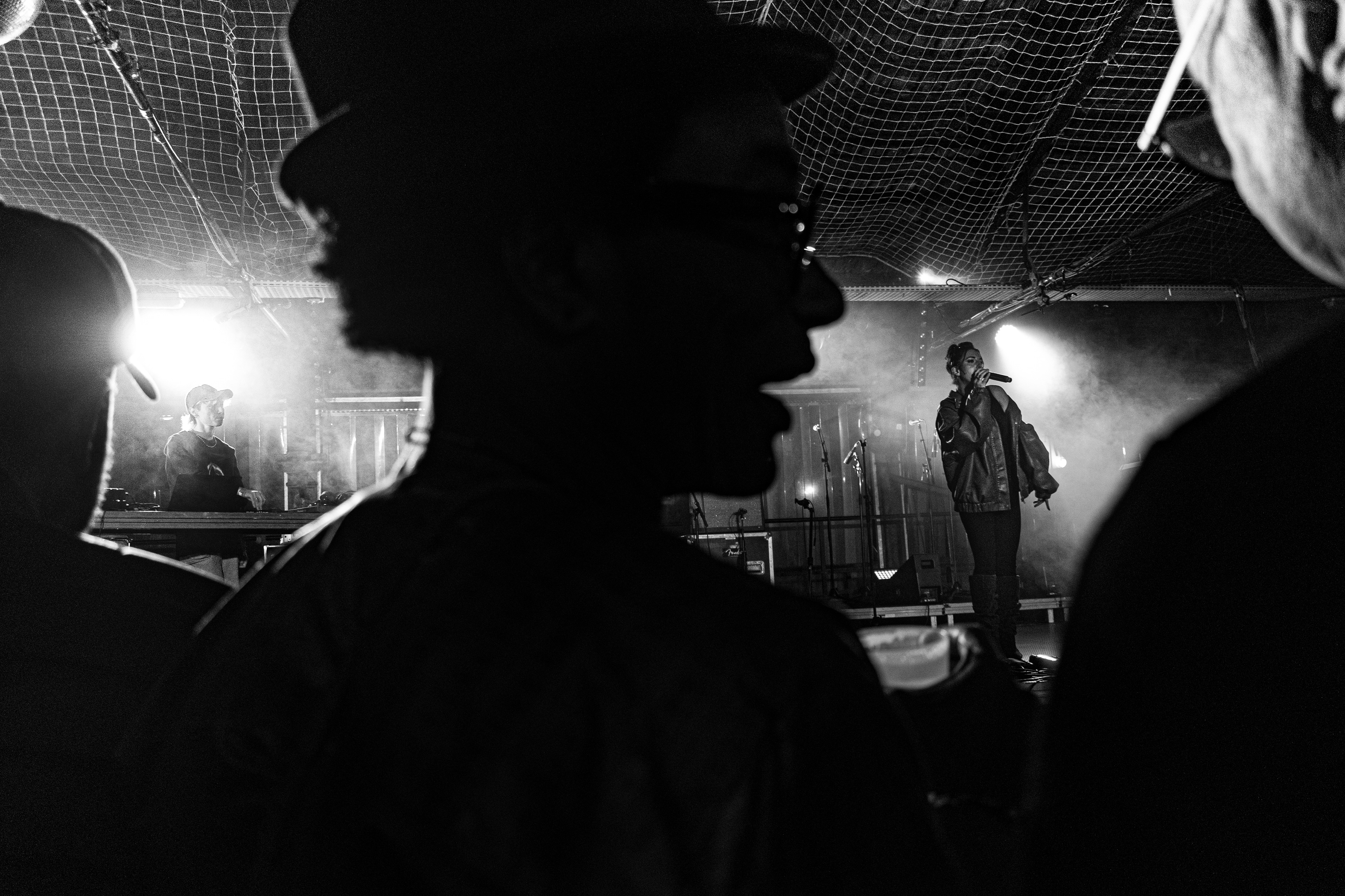"Point fort d'Aubervilliers", 93 district. Paris, October 11th, 2025. A figure in the crowd at point fort d'Aubervilliers's concert hall where Rose Oyemi, member of the collective, has previously performed. 
