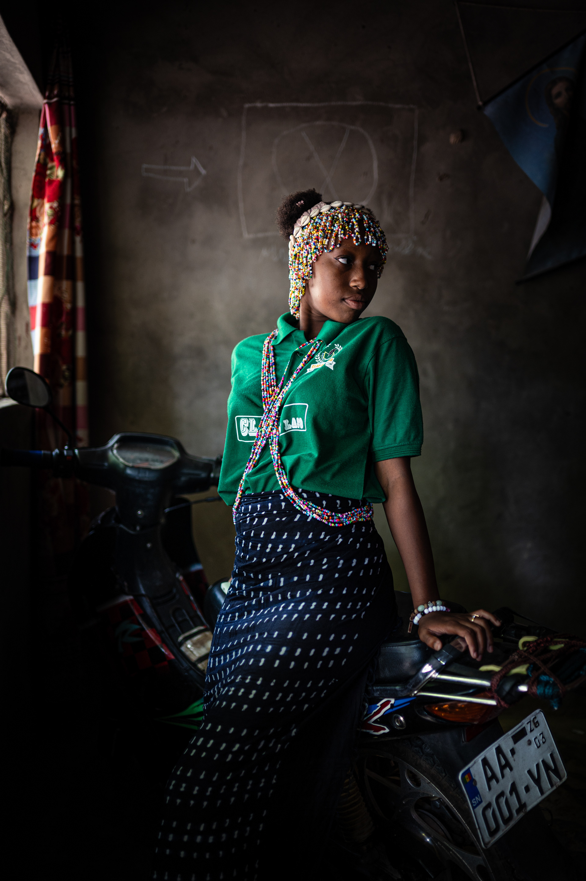 Jeanne d'Arc posing in traditional clothes and jewellery during the Boukout ceremony in Sengalene village, Casamance region, Senegal. August 5, 2026.