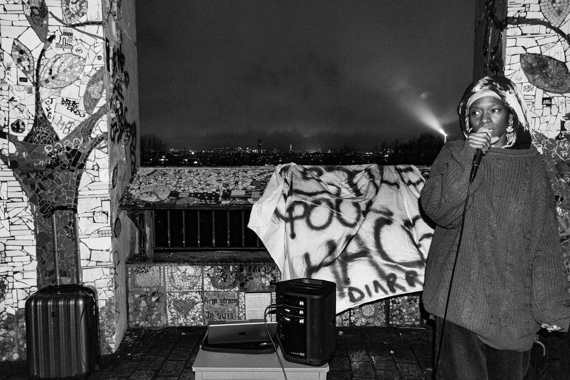 Belvedere de Belleville, 20th arrondissement. February 11, 2026. Rose is performing at the open mic night. This open mic event has been organised in tribute to El Hacen Diarra, who died in police custody following a violent arrest by the police on the night of 15–16 January 2026.