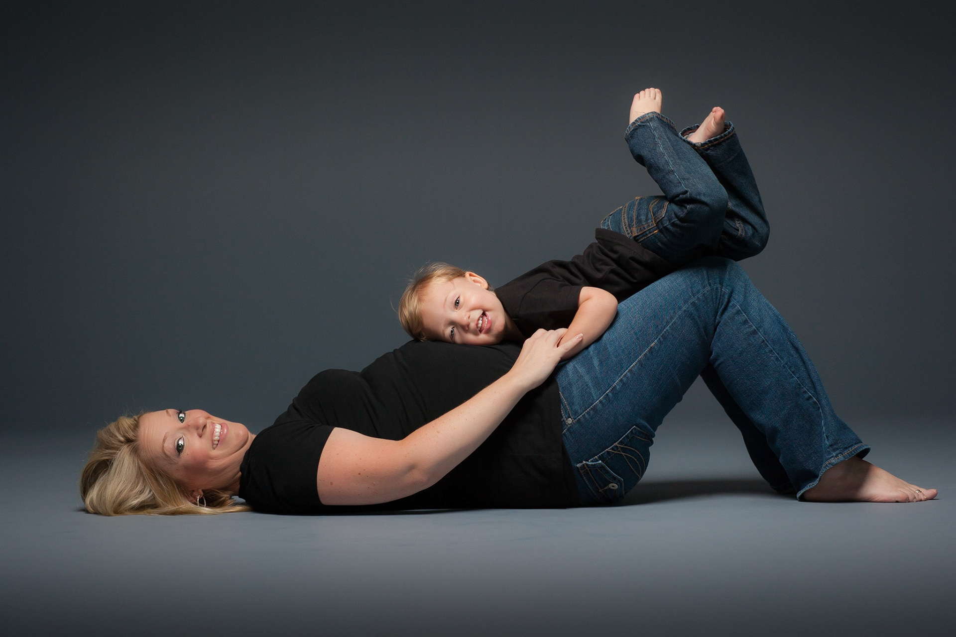 Expectant Mother With Son Listening For His New Sister's HEart 
