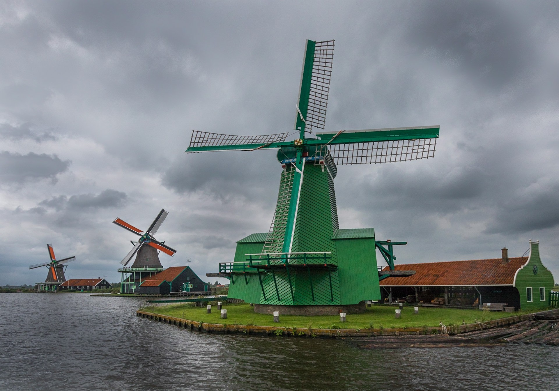 Three Zaanse Schans windmills on the bankds of the Zaan River.  Zaanse Schans (near Amsterdam), Netherlands (2018)