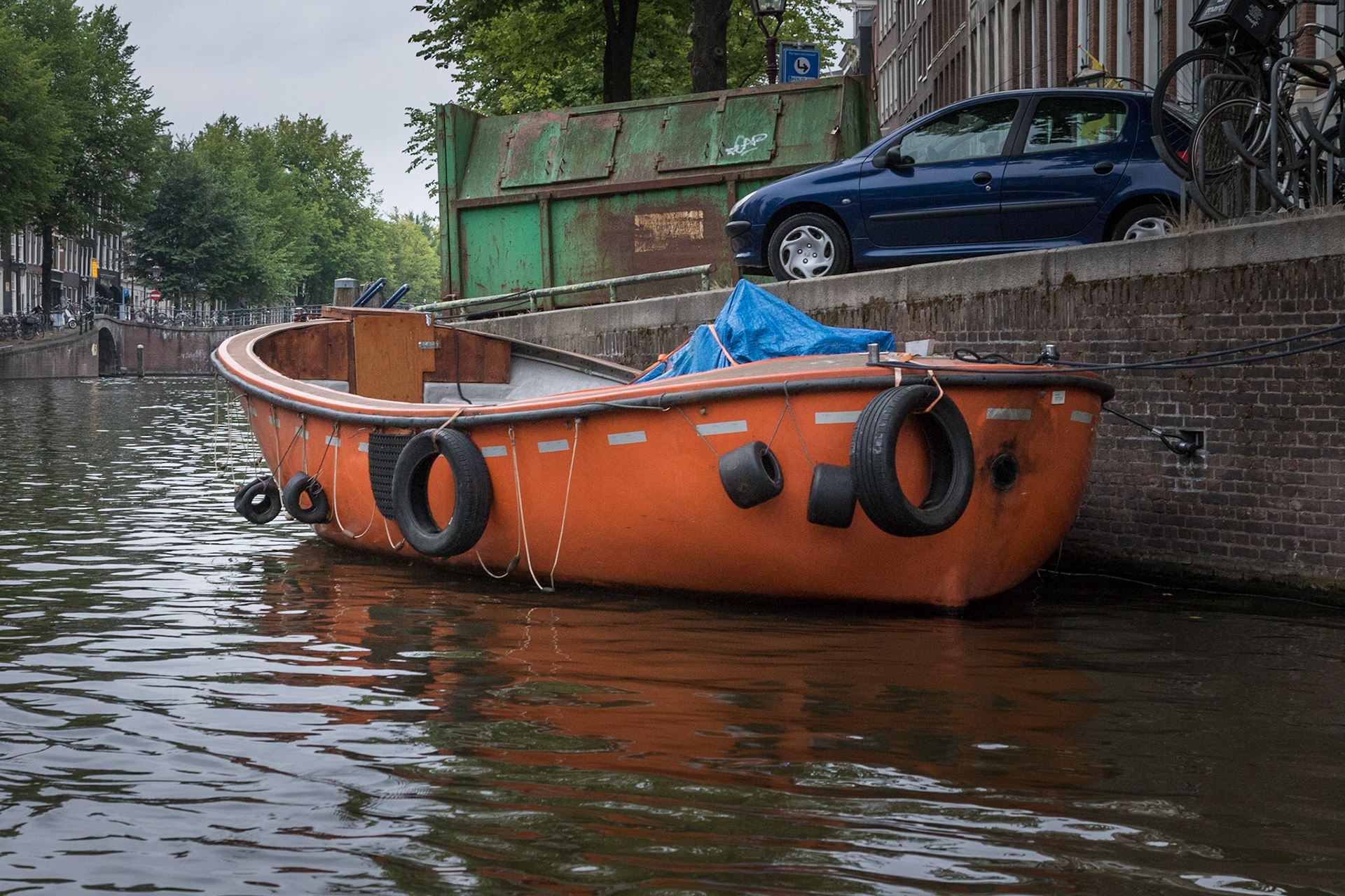 Orange boat in Amsterdam Canal, Netherlands (2018)