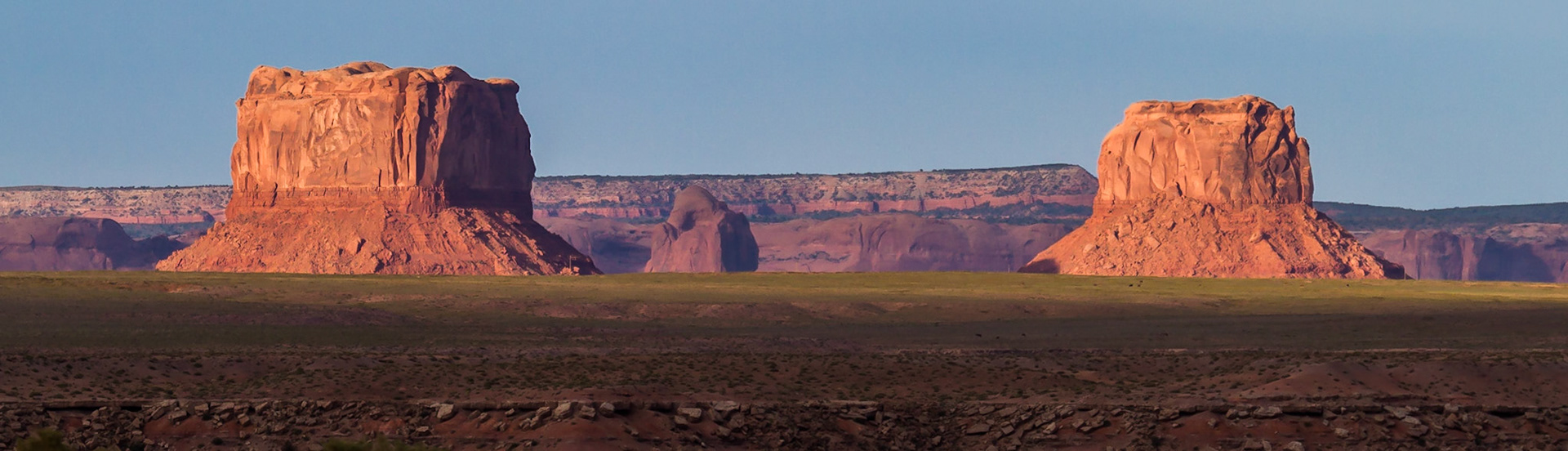 Two Butte's near Round Rock Arizona.  Driving between Needles CA (where CA meets AZ at the Colorado river east of Barstow) and Blanding UT (between Monument valley and Moab) we saw this off the side of the road.  We were getting that pre-sunset golden Southwest light (around 5:30 in May) which turns the red rock on the buttes thjis amzaing rich red color.  Had to walk a little ways across some scrub to a barb wire fence in order to shoot over it such that it did not clutter the shot, but was well wotth the effort.