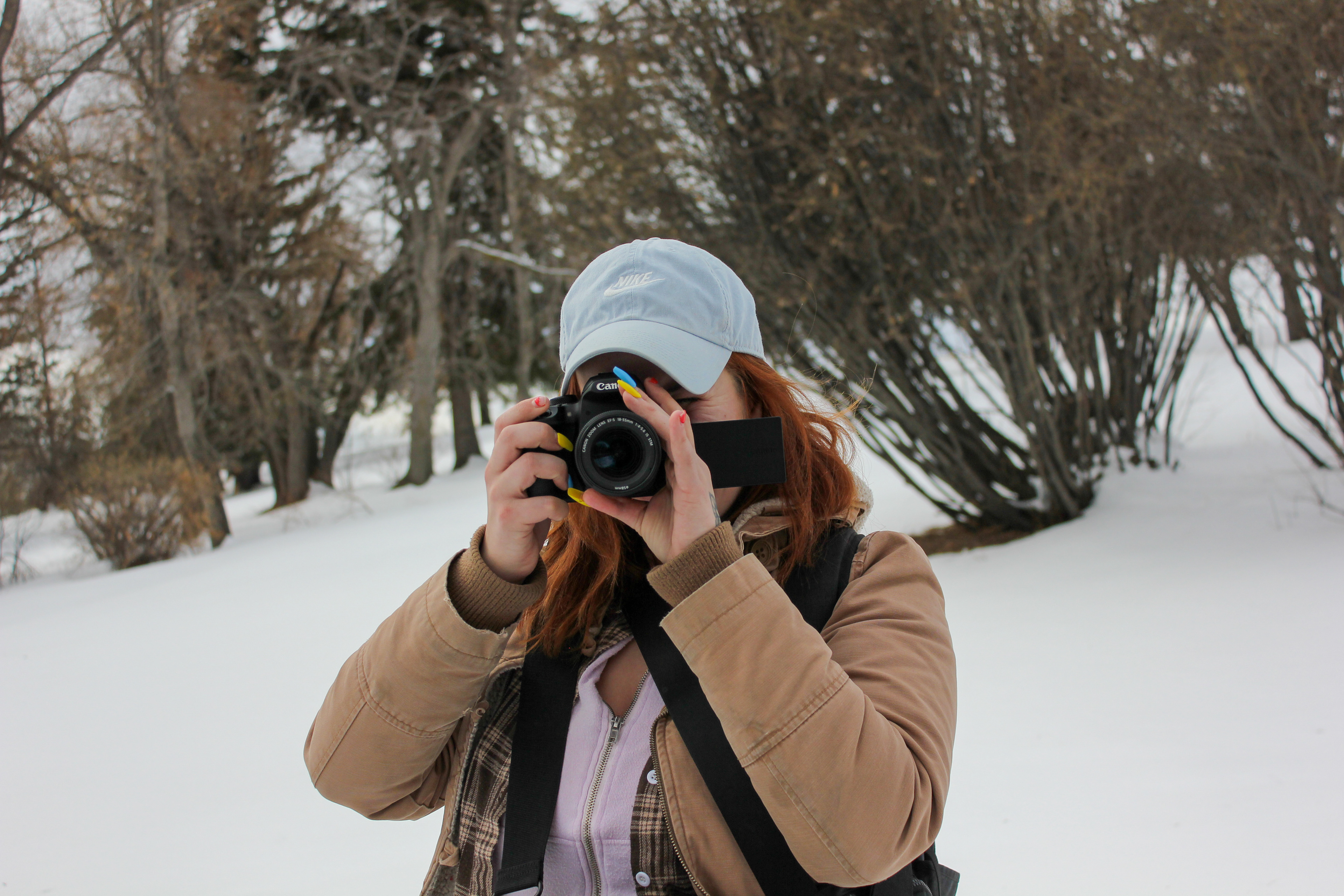 Jenna Willox posing with her camera. A photo by Gur Sodhi
