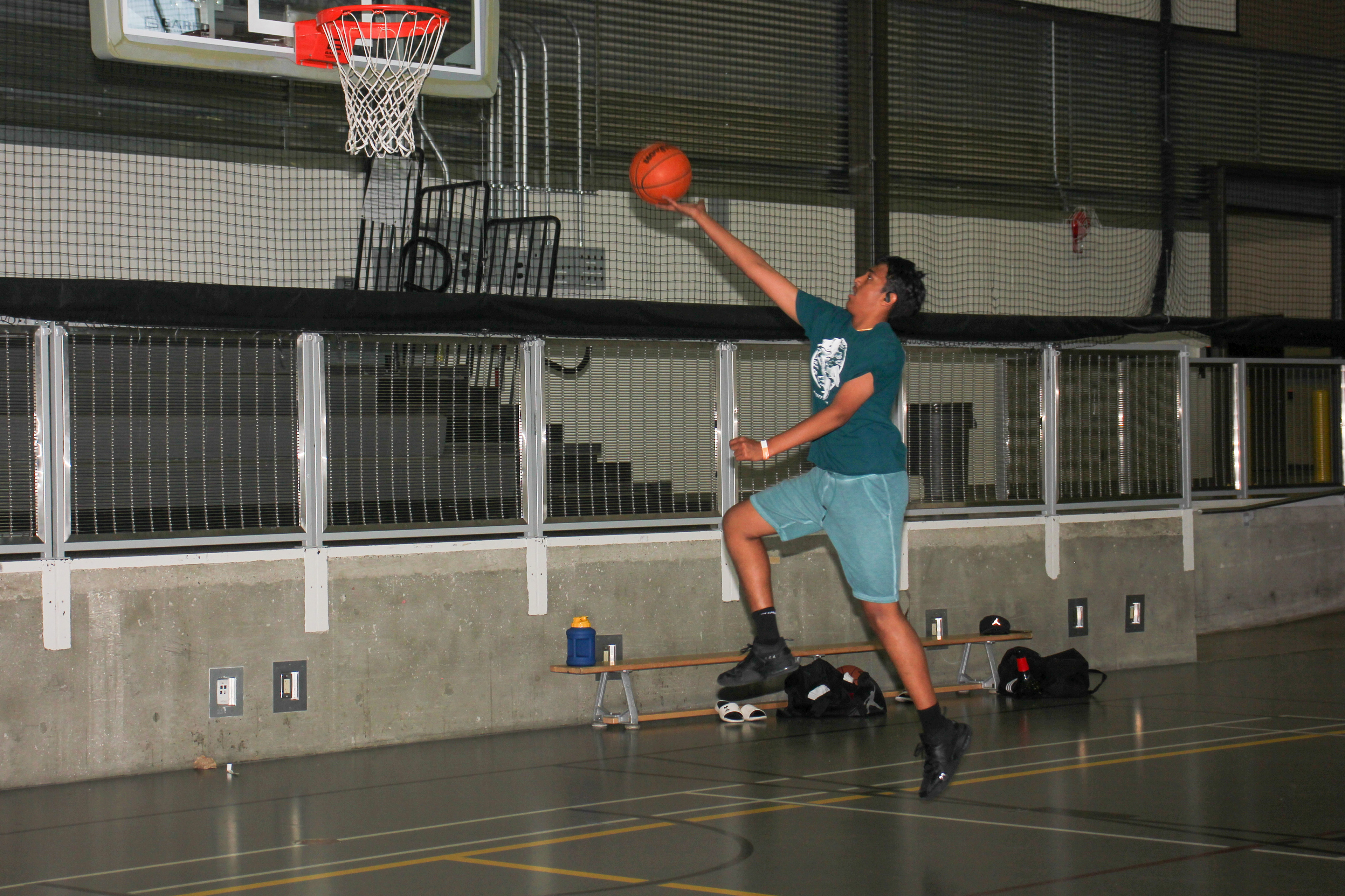 Ethan performing a lay up shot. A photo by Gur Sodhi