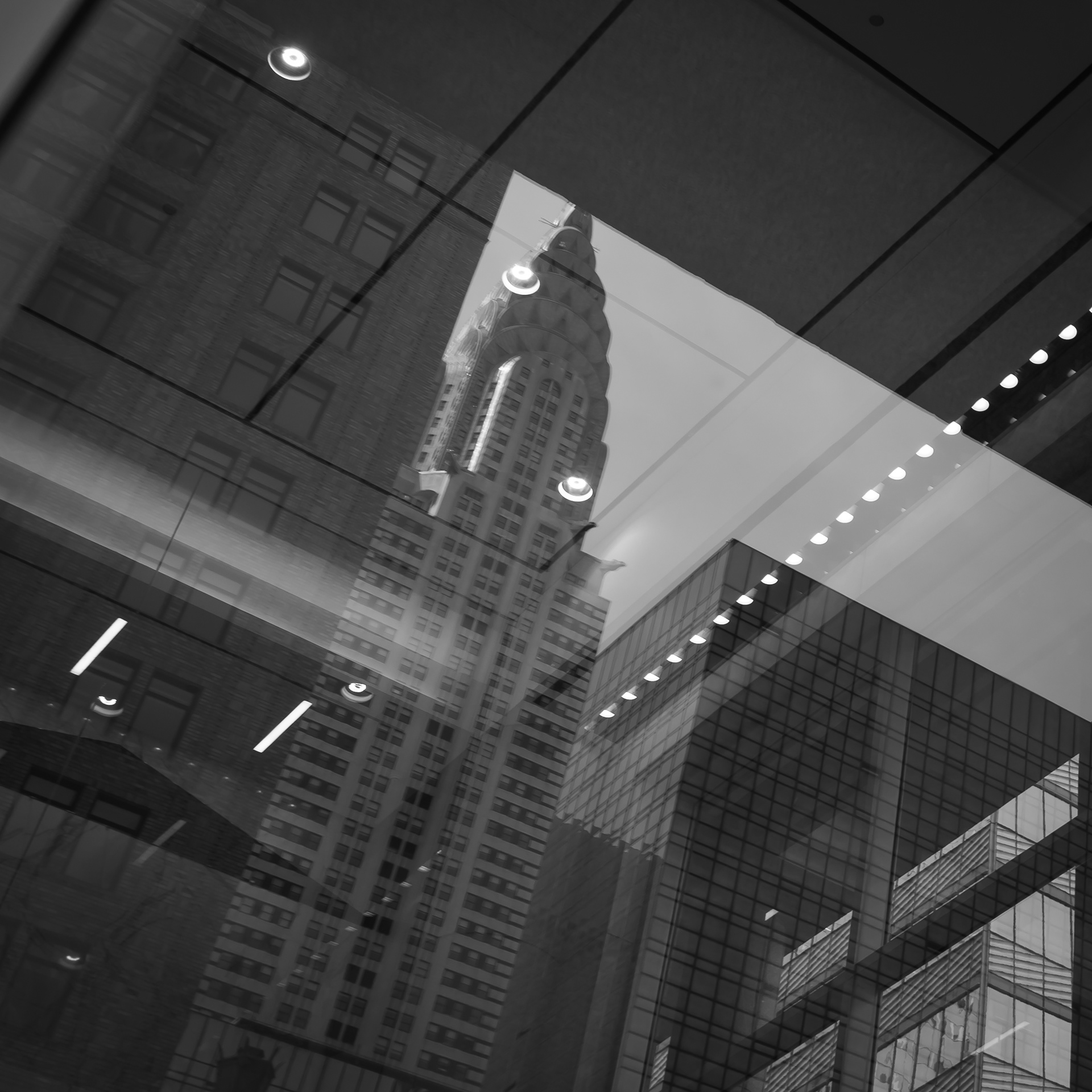 Glass reflections are a crucial aspect of street photography. They add depth, complexity, and visual interest to the overall picture, providing an additional layer to the scene and creating a fuller perception of the setting in which the photograph was made. Glass reflections can also distort reality, creating abstract or surreal effects that add mystery and intrigue to the image. By playing with light, angles, and the surface of the glass, photographers can create visually exciting ideas that challenge our ordinary viewpoints. Reflections are a great source of surprise and unpredictability in street photography. They can also be used as visual metaphors or symbols that evoke duality, introspection, or contrast societal elements, reflecting the complexities of urban life and the struggles and joys of urban people.