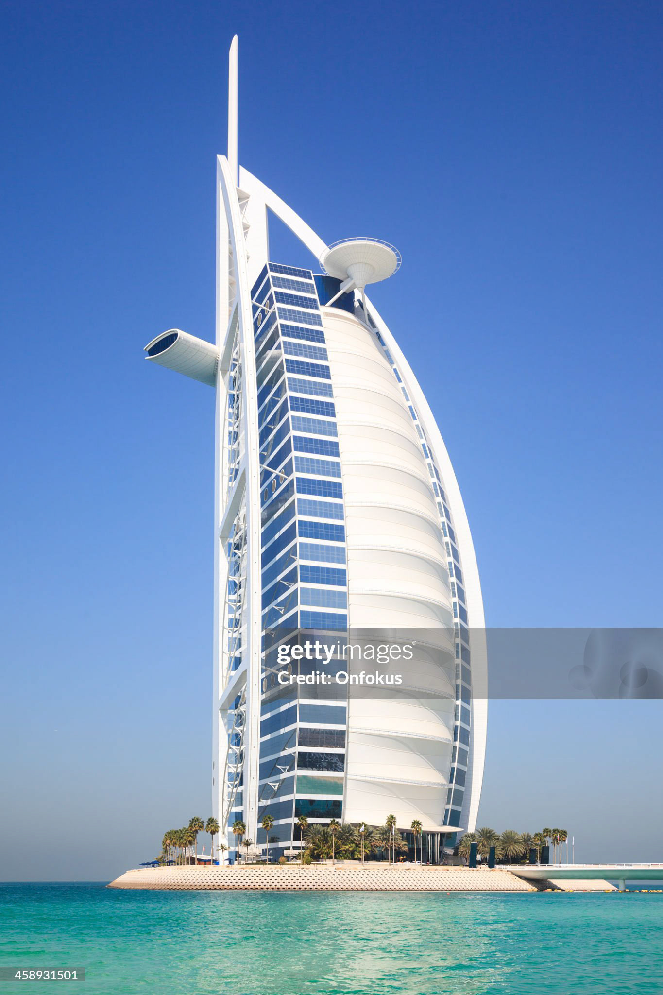 Dubai, United Arab Emirates - February 17, 2010: View of Burj Al Arab hotel from the Jumeirah beach. Burj Al Arab is one of the Dubai landmark, and one of the world's most luxurious hotels with 7 stars