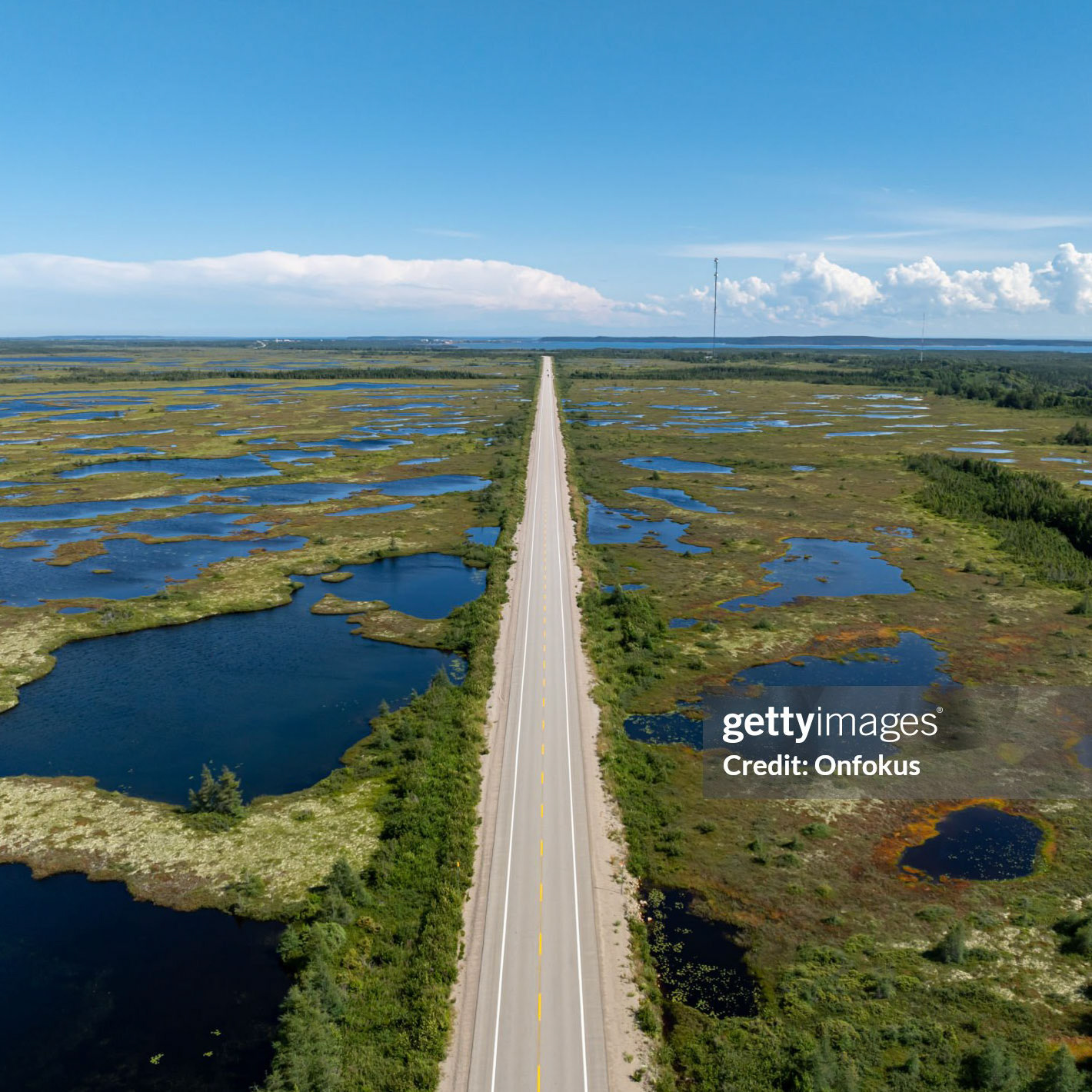 Aerial View of Highway 138 in Cote Nord Region, Quebec, Canada During Summer. An almost empty road along the St. Lawrence river showing beautiful landscapes.