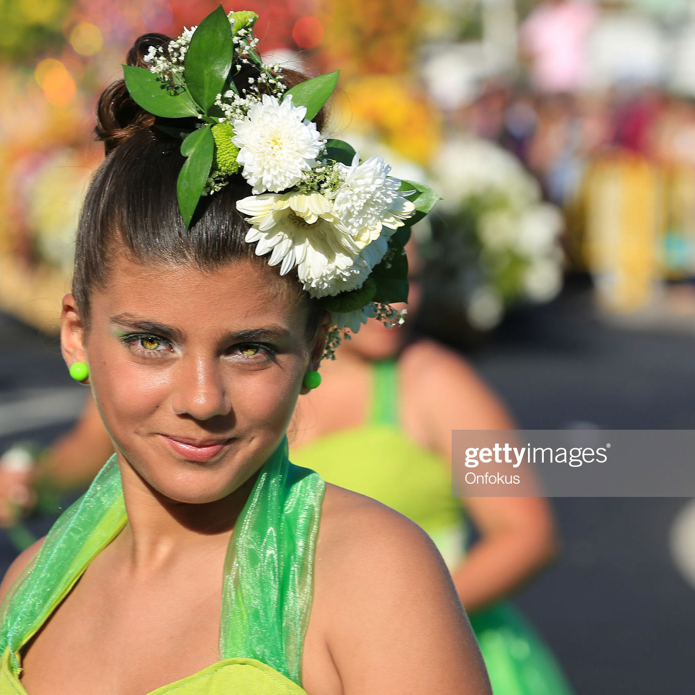 Funchal, Portugal - April 22, 2012: Madeira Flower Festival  Festa da Flor is a annual festival and parade in the city of Funchal. People dress with flowers are dancing on the street.