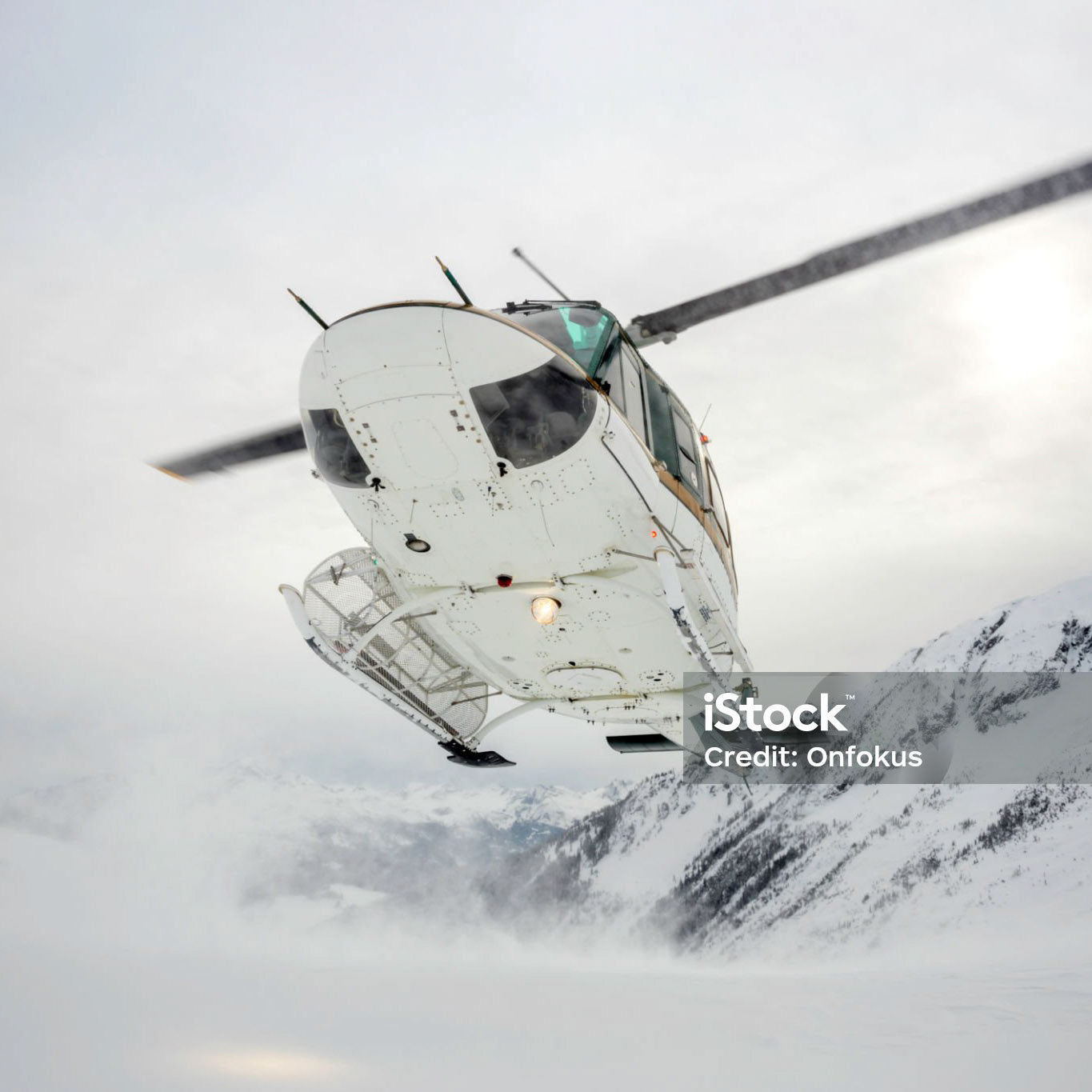 Helicopter Landing on Mountain Summit, Heli-Skiing and Backcountry Skiing