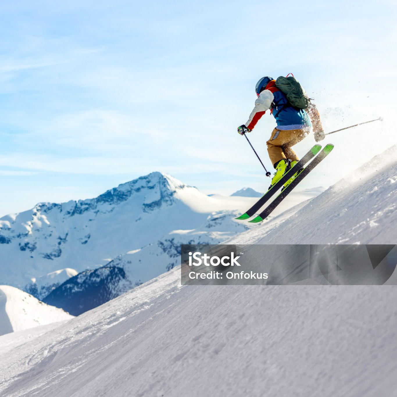 Man skier in action in backcountry area with fresh powder snow at Whistler-Blackcomb Ski Resort