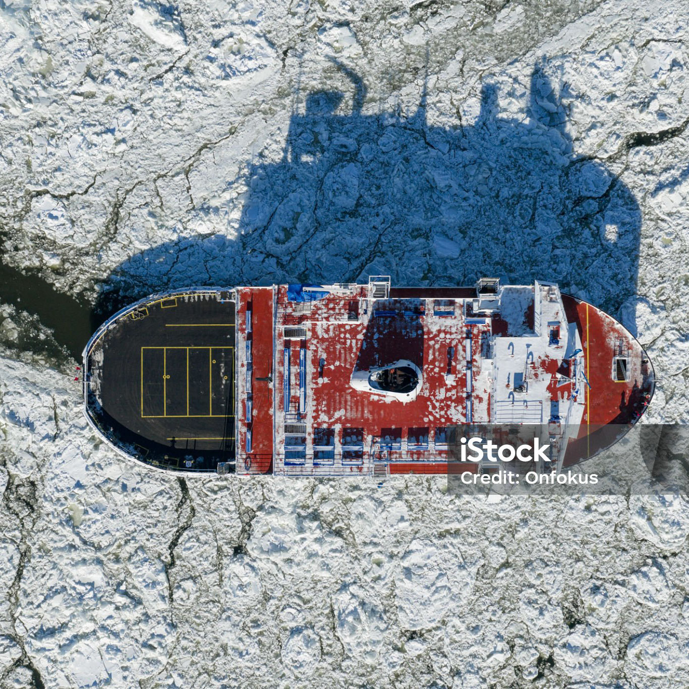 Aerial View of a Ferry Between Quebec City and L?vis During Winter, Canada. The Ferry is crossing the St. Lawrence River while ice is building up during the cold months.