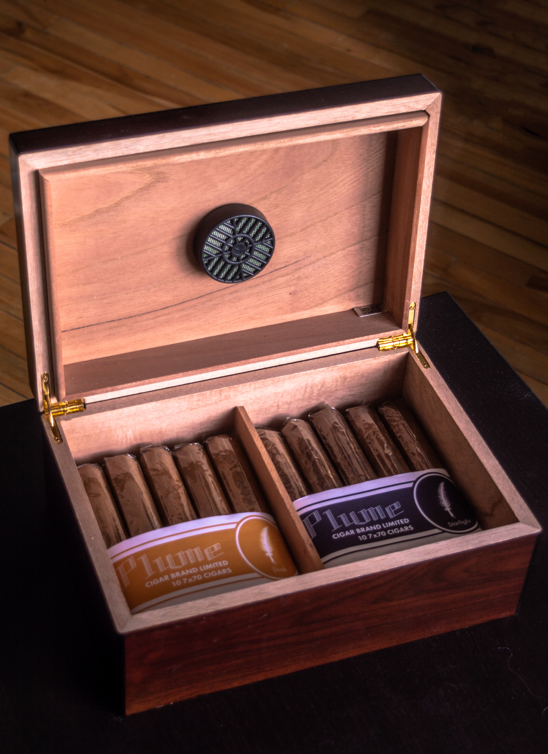 A photo of 2 packs of cigars with Plume refill packaging on them