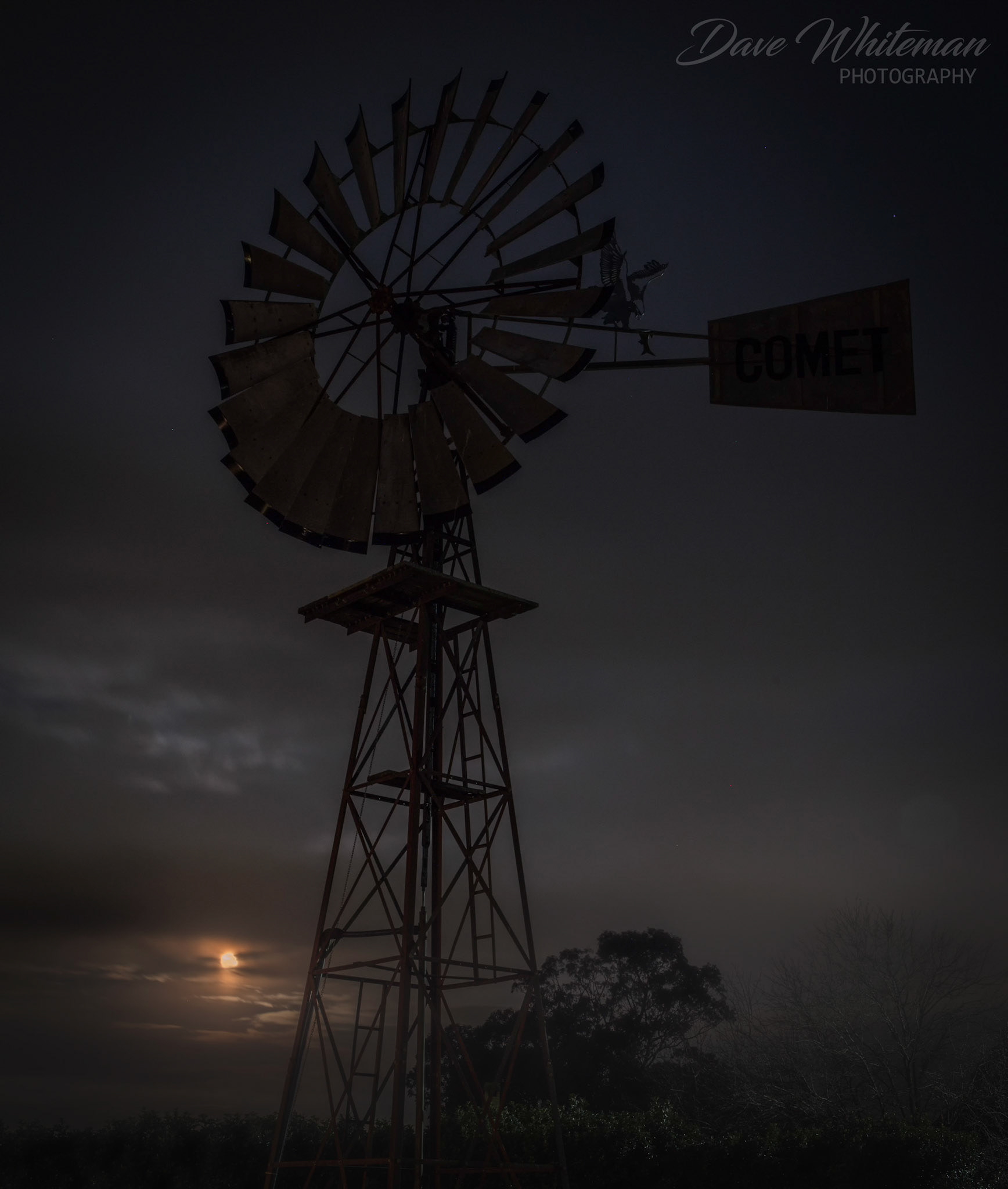 A full moon rising under the windmill at Silverdale.