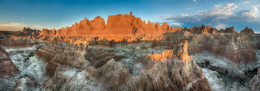 The Badlands, morning, sunrise, crevasse, colors. National Park, South Dakota, moon, clouds