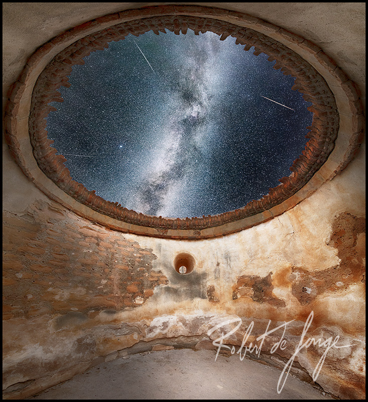The Milky Way shines above the open Dome of an old Spanish mission in Arizona