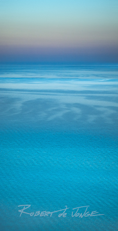 The colors and patterns of Lake Michigan show themselves before dawn from near the overlook on the Pierce Stocking scenic drive.